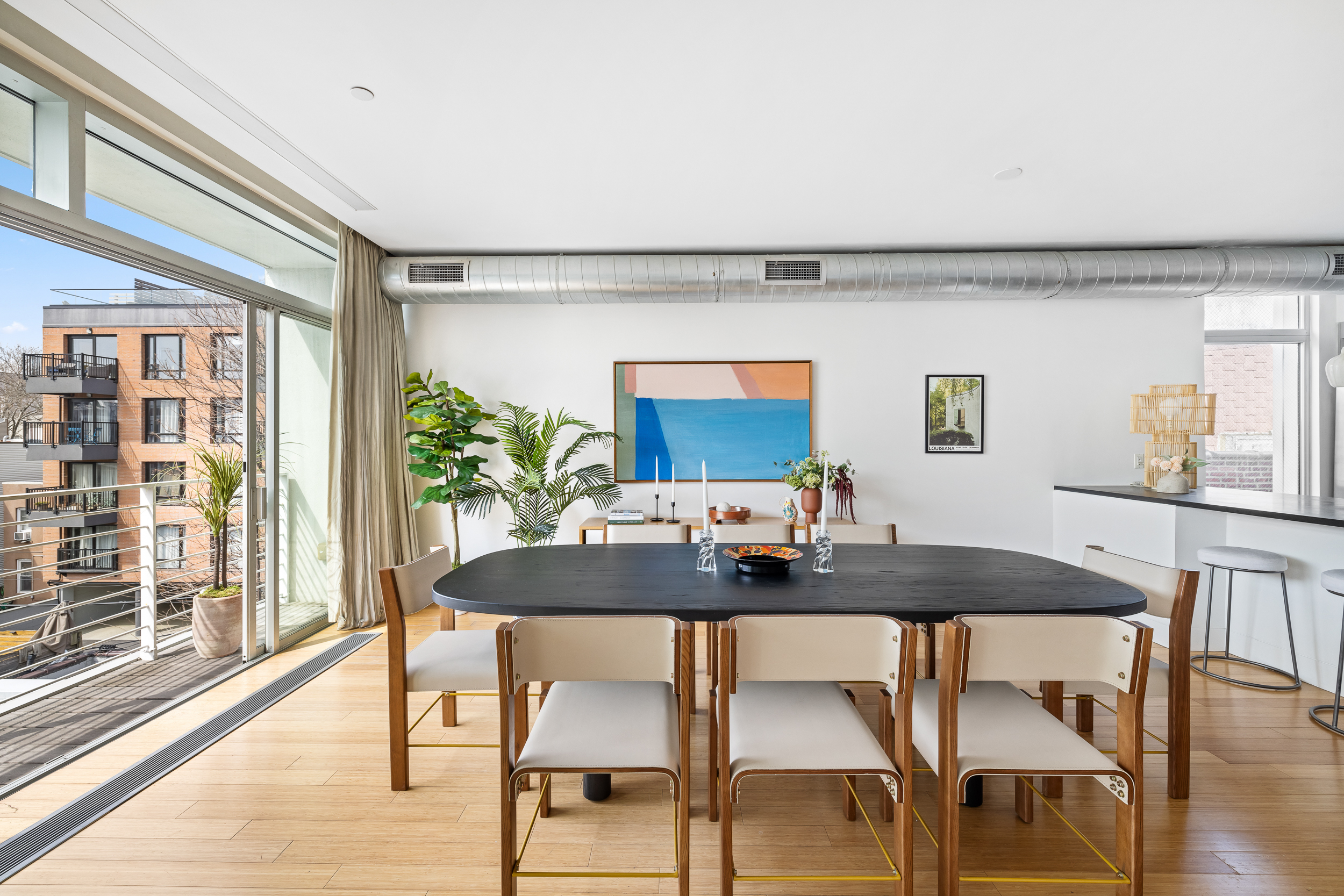 361 Manhattan Avenue, Unit 3AB Brooklyn, NY 11211 - Photo 1 of 21 a view of a dining room with furniture and wooden floor