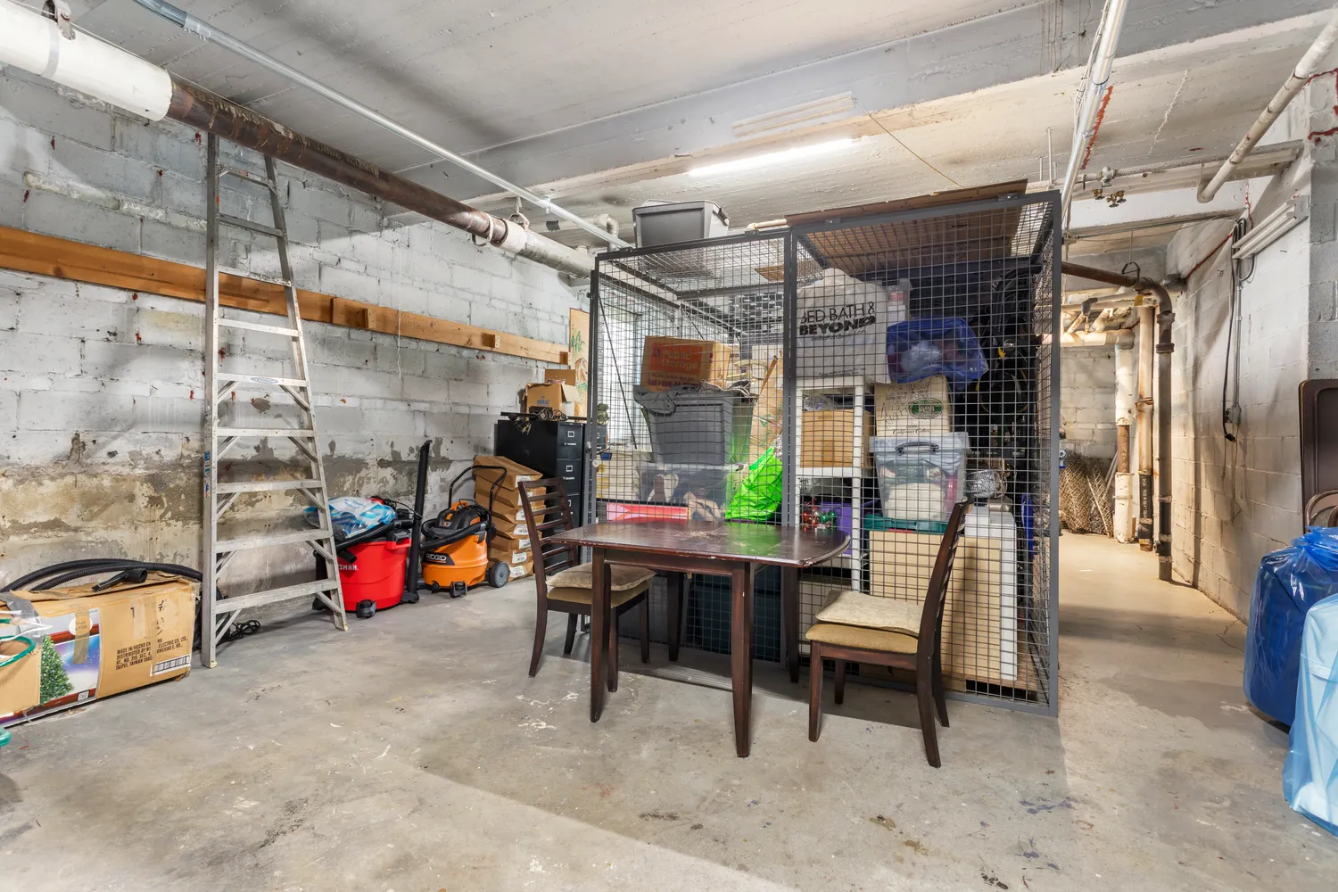a view of a garage with a table and chairs