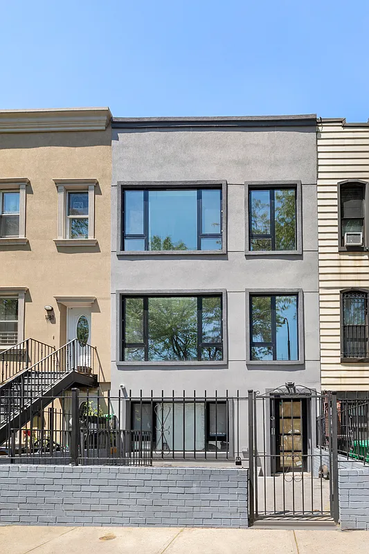1183 Jefferson Avenue, Unit 1 Brooklyn, NY 11221 - Photo 11 of 11 a view of a brick house with many windows