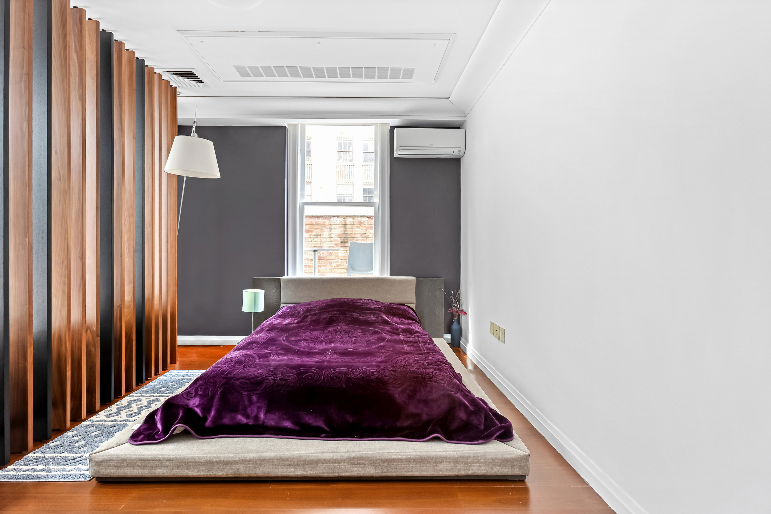 55 Wall Street, Unit PH942 Manhattan, NY 10005 - Photo 5 of 9 a bedroom with a bed and window