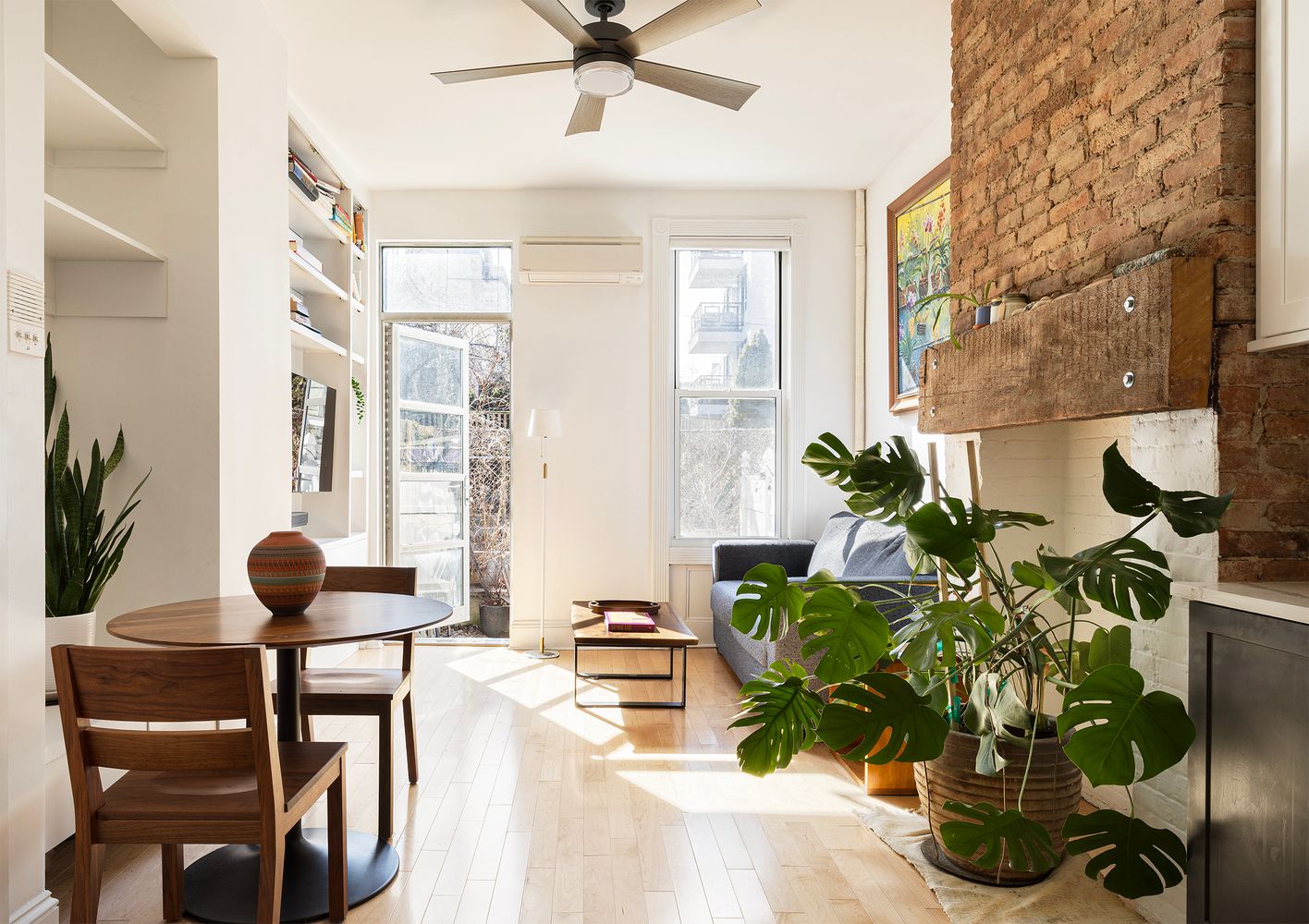 a view of living room with furniture and a potted plant