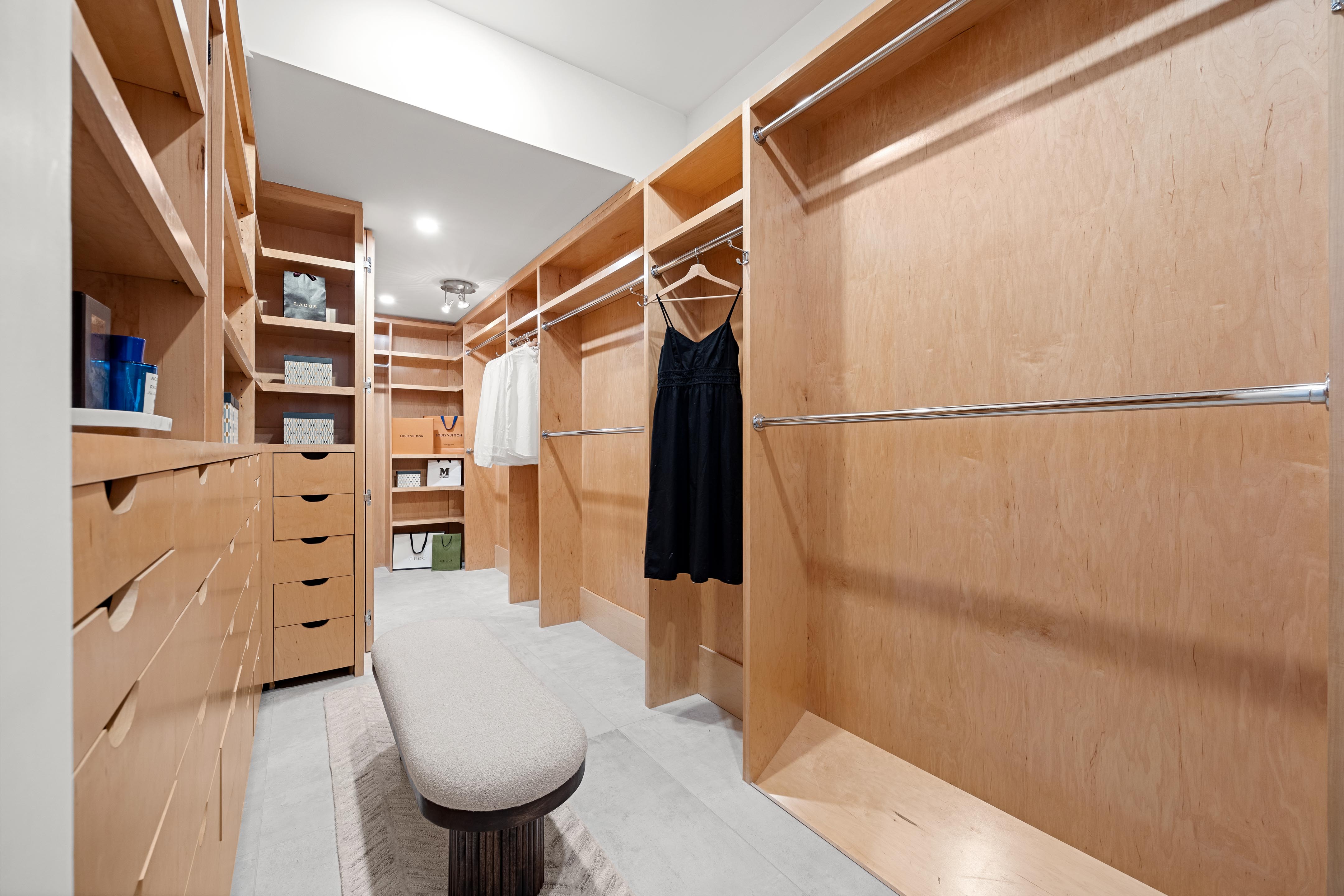 422 East 72nd Street, Unit 37AD Manhattan, NY 10021 - Photo 14 of 38 a view of walk in closet with clothes and shoes