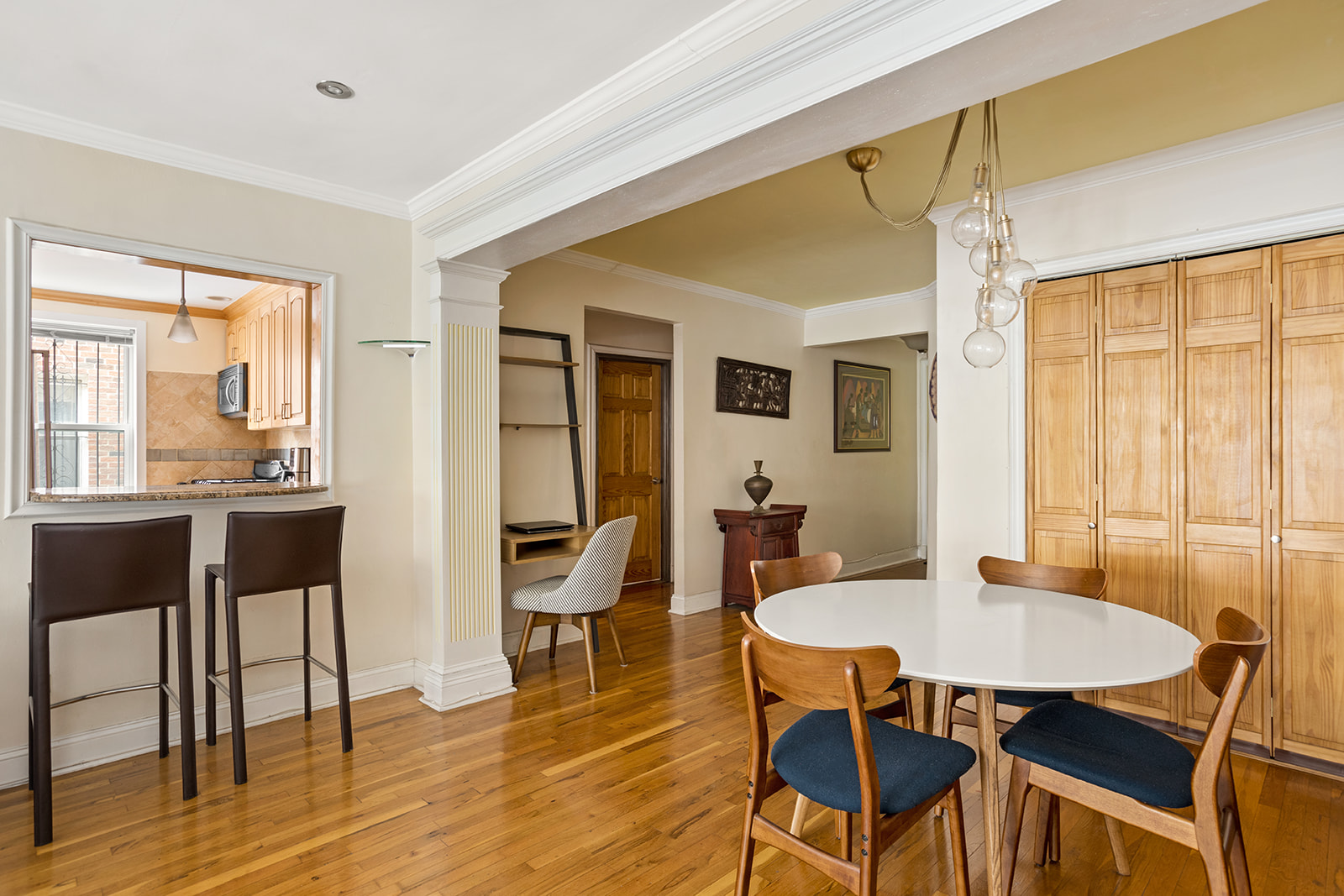 79-10 34th Avenue, Unit 2G Queens, NY 11372 - Photo 4 of 11 a view of a dining room with furniture and wooden floor