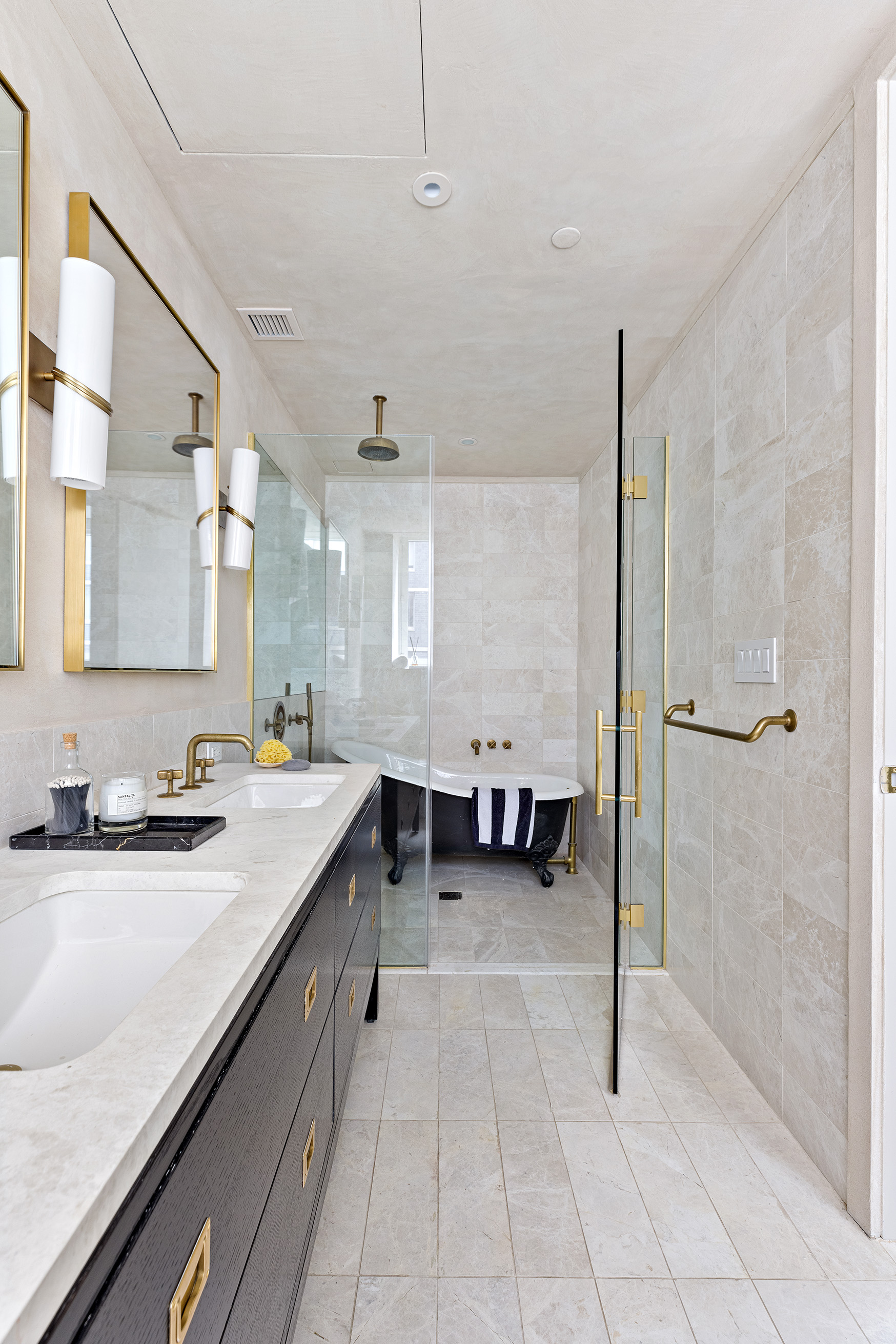 93 Worth Street, Unit 311 Manhattan, NY 10013 - Photo 14 of 17 a view of a kitchen with a sink and a refrigerator