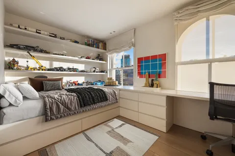 a living room with furniture window and flat screen tv