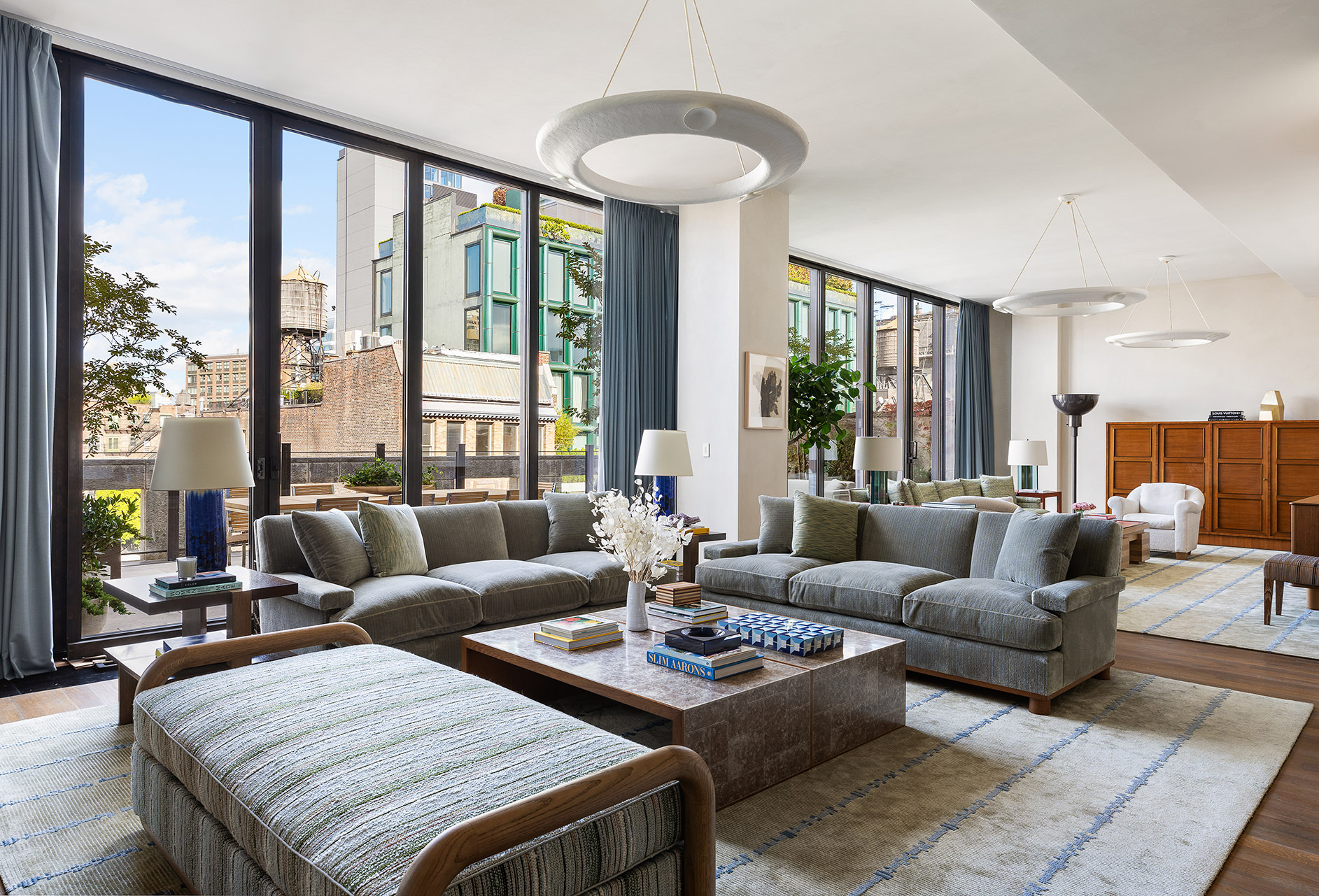 25 Bond Street, Unit PHW Manhattan, NY 10012 - Photo 2 of 34 a living room with furniture and a large window
