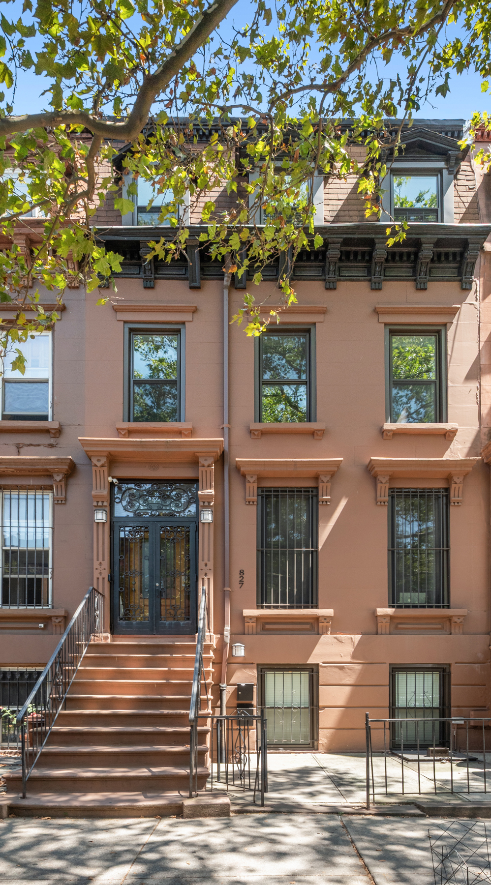 827 Marcy Avenue Brooklyn, NY 11216 - Photo 15 of 17 a front view of a house with a garage