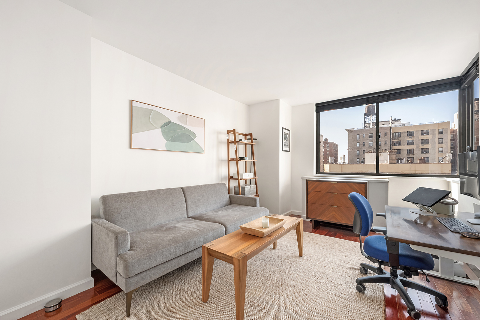 225 West 83rd Street, Unit 8L Manhattan, NY 10024 - Photo 10 of 18 a living room with furniture and a large window