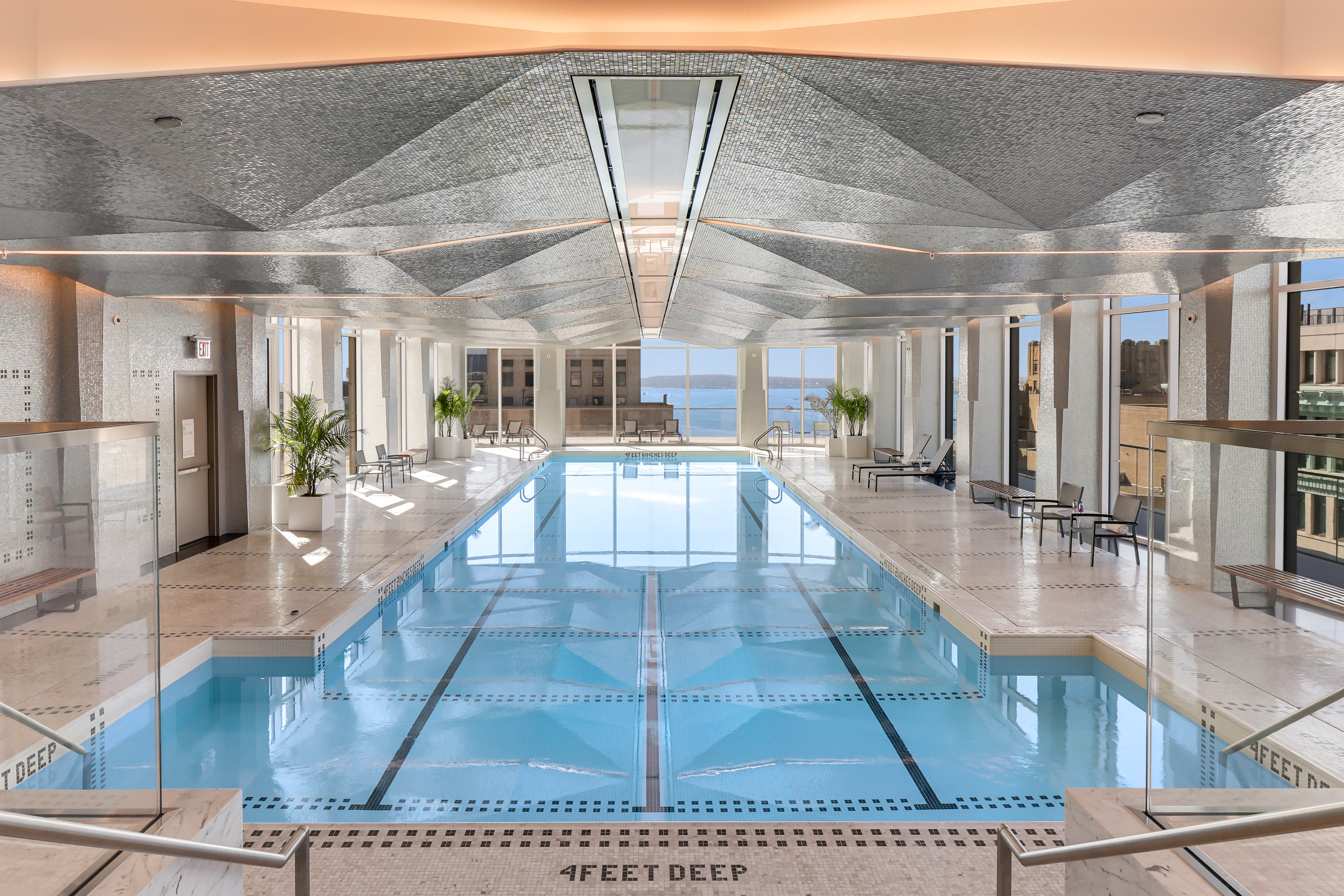 1 Wall Street, Unit 2512 Manhattan, NY 10005 - Photo 15 of 31 a view of a living room and kitchen
