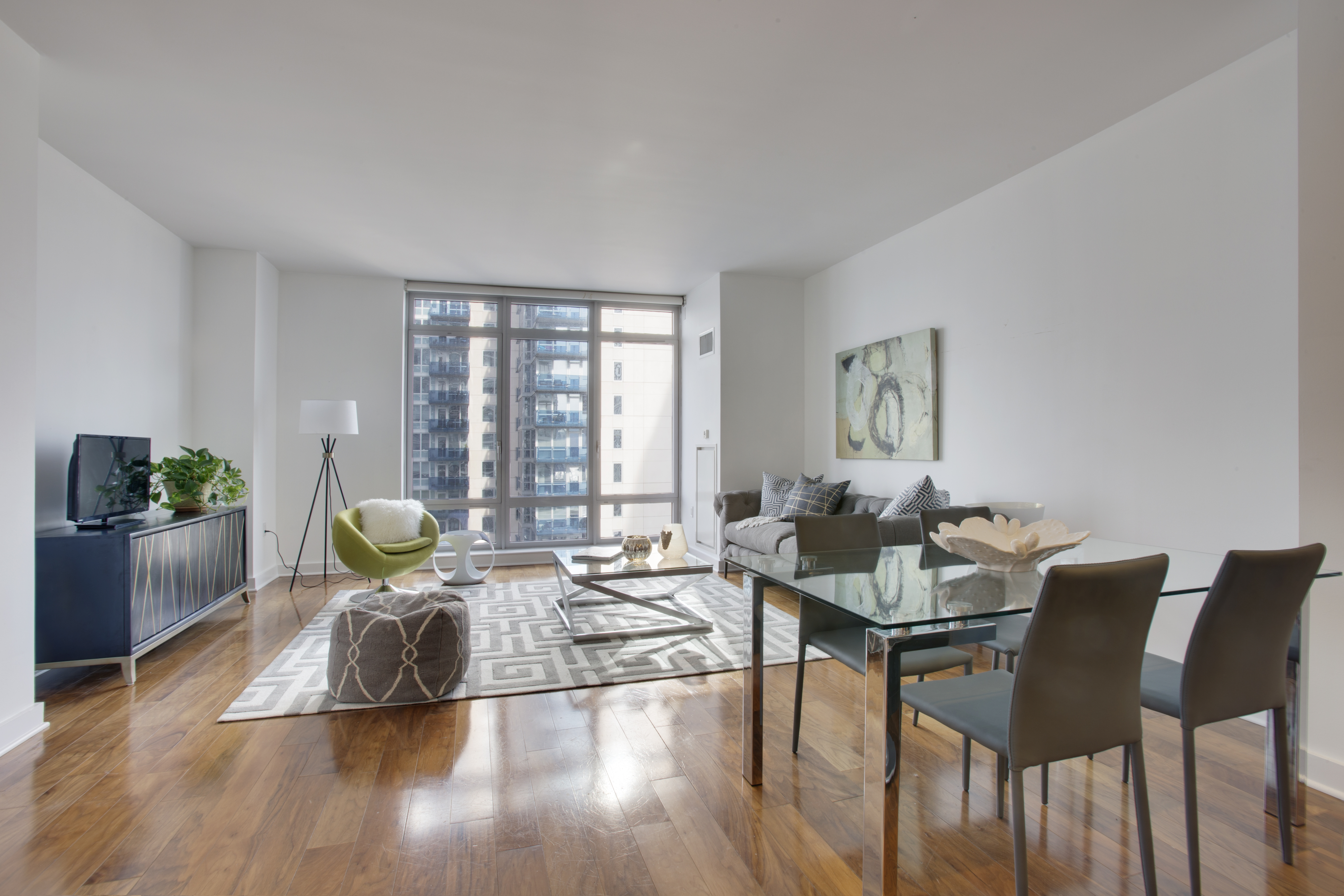 2 Northside Piers, Unit 8H Brooklyn, NY 11249 - Photo 6 of 20 a living room with furniture and wooden floor