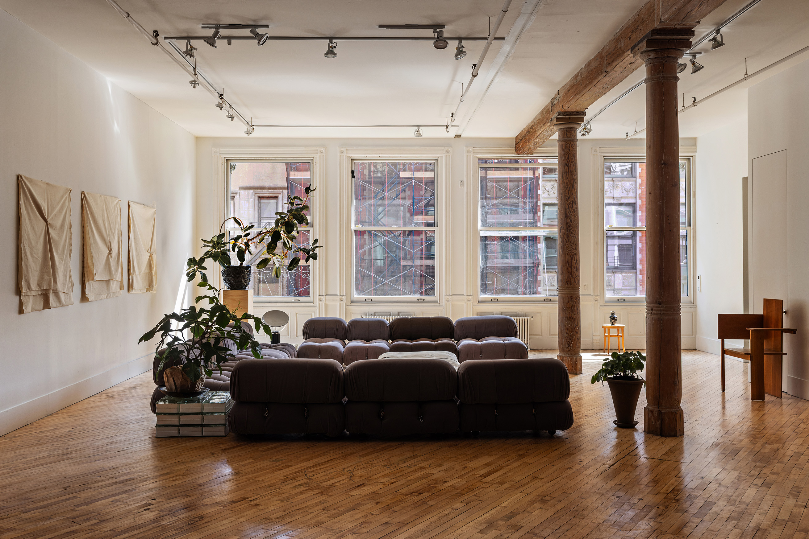 a living room with furniture window and wooden floor