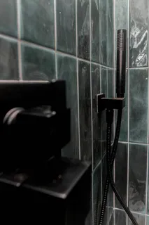 a white bath tub sitting in a bathroom