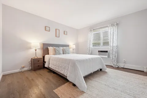 a bathroom with a sink toilet a mirror and shower