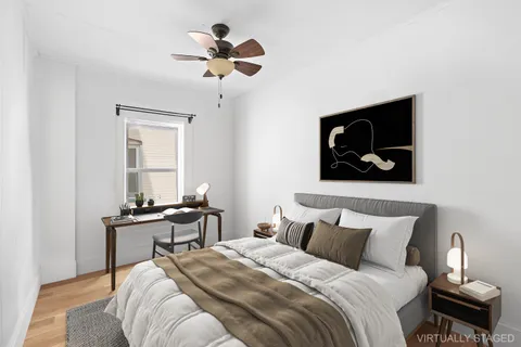 a bedroom with bed and window