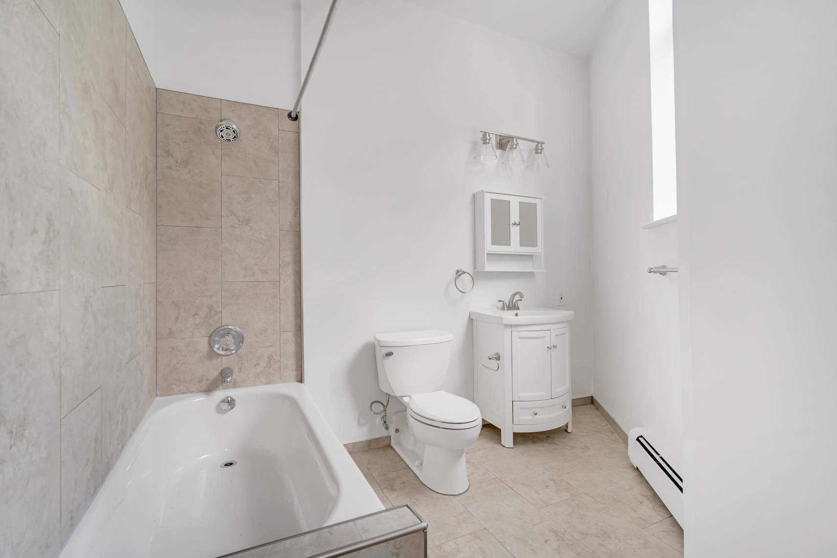 2 Cornelia Street, Unit 201 Manhattan, NY 10014 - Photo 7 of 11 a bathroom with a sink toilet and shower