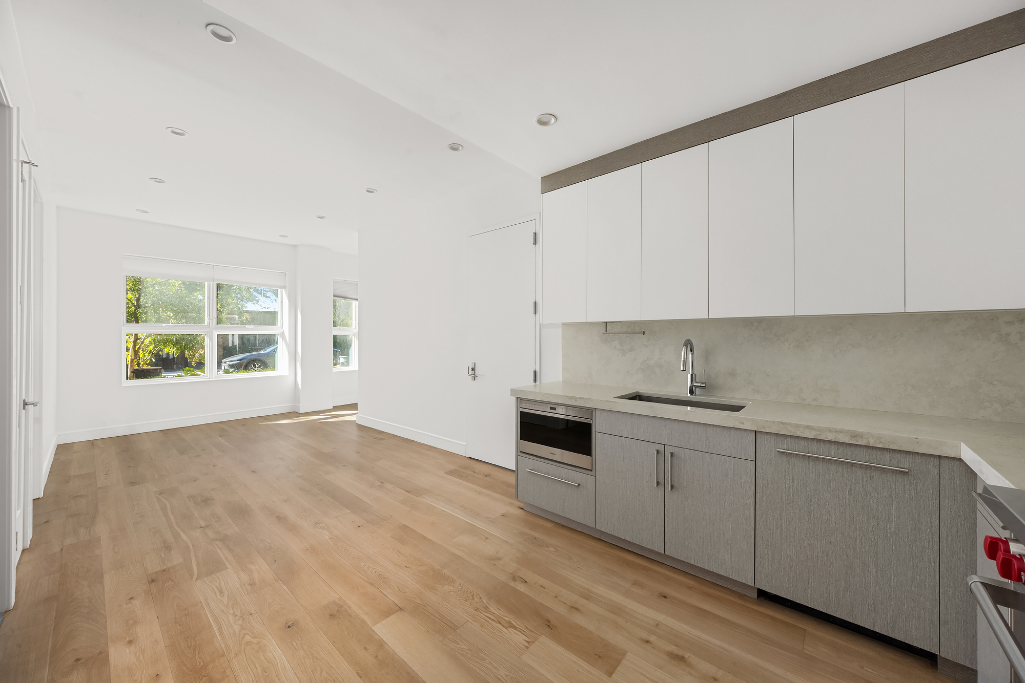 45 Garnet Street, Unit 1A Brooklyn, NY 11231 - Photo 2 of 13 a kitchen with granite countertop white cabinets and a stove top oven