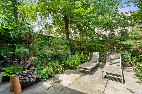 a garden view with a seating space