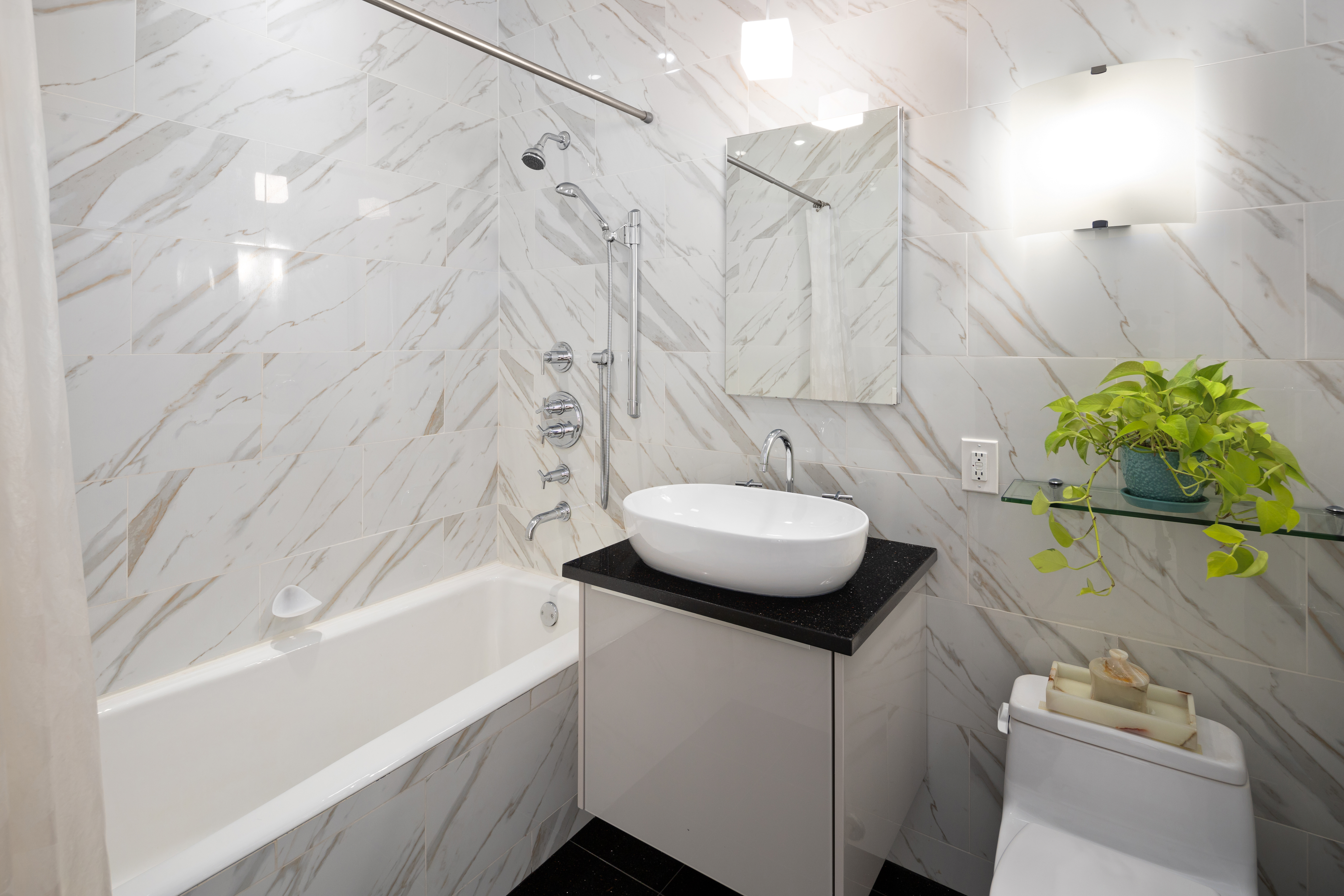 59 John Street, Unit PH1 Manhattan, NY 10038 - Photo 10 of 15 a bathroom with a sink and a mirror