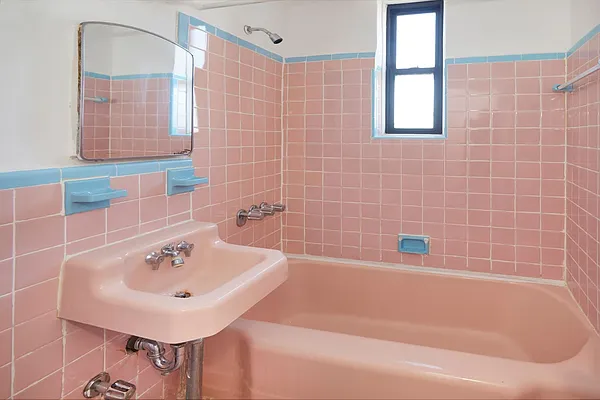 506 West 145th Street, Unit 4D Manhattan, NY 10031 - Photo 6 of 9 a white bath tub sitting next to a white sink