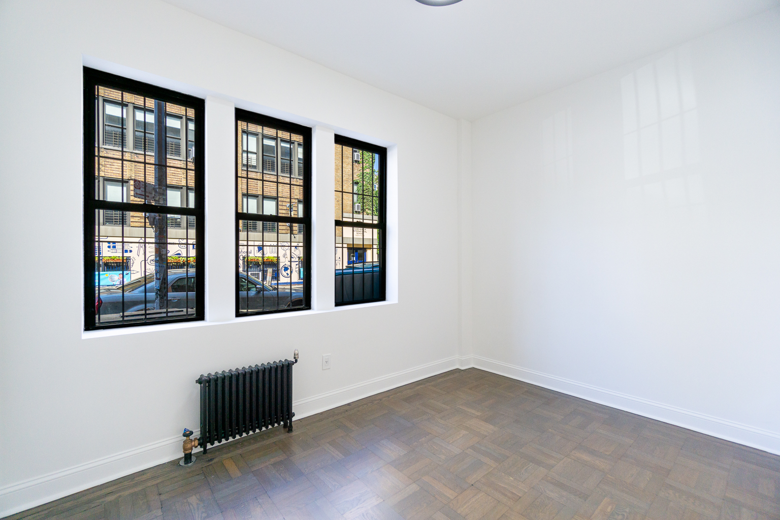 51 East 2nd Street, Unit 2 Manhattan, NY 10003 - Photo 3 of 18 an empty room with windows