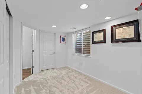 a view of a house with snow on the road