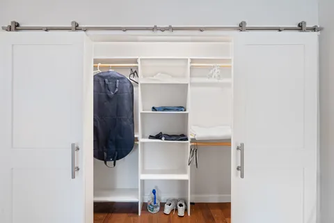 a bathroom with a shower and a toilet