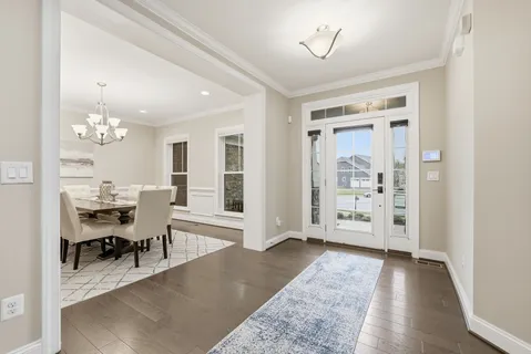 a view of a livingroom with kitchen and dining room