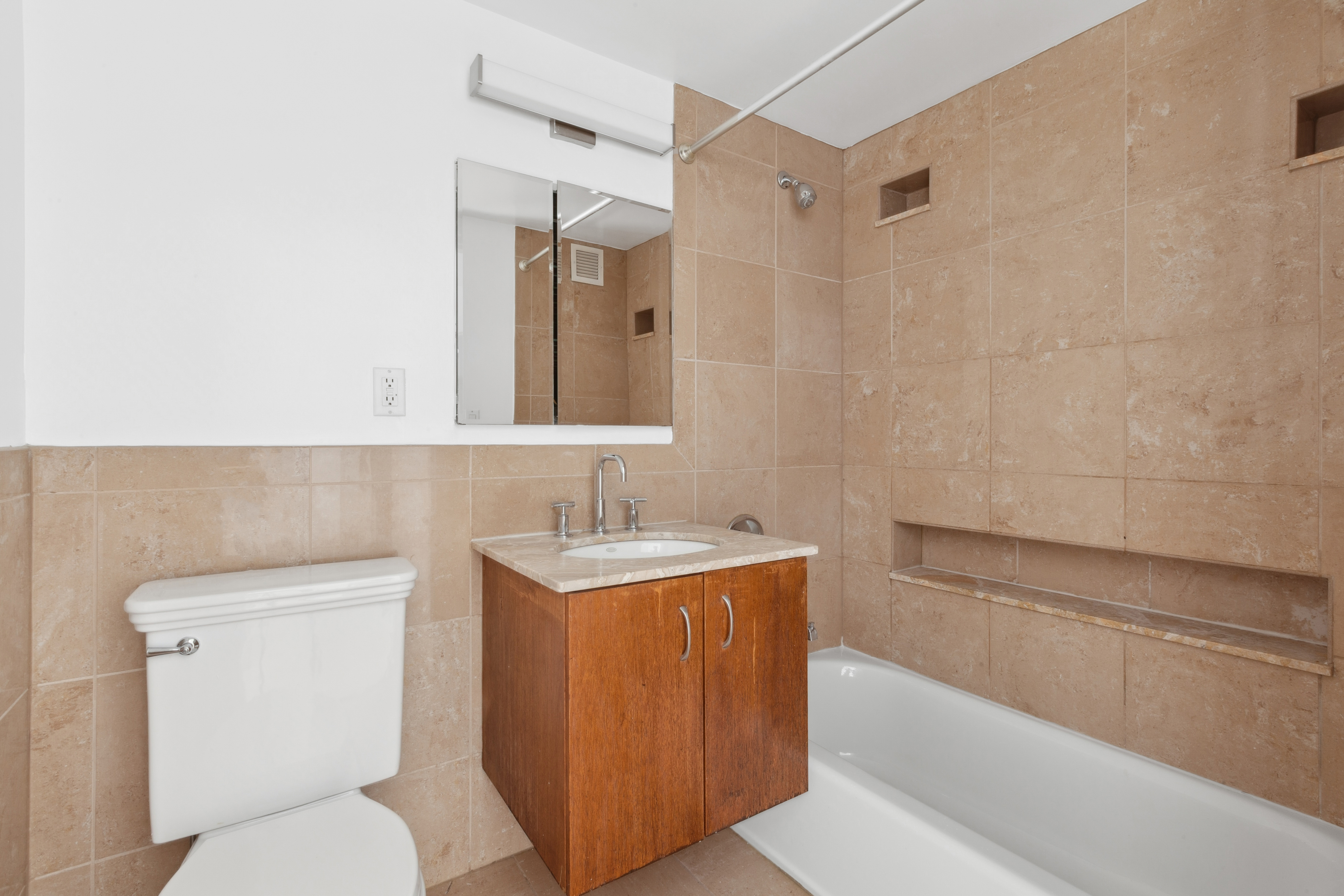 266 West 115th Street, Unit 2B Manhattan, NY 10026 - Photo 6 of 11 a bathroom with a toilet a sink and bathtub