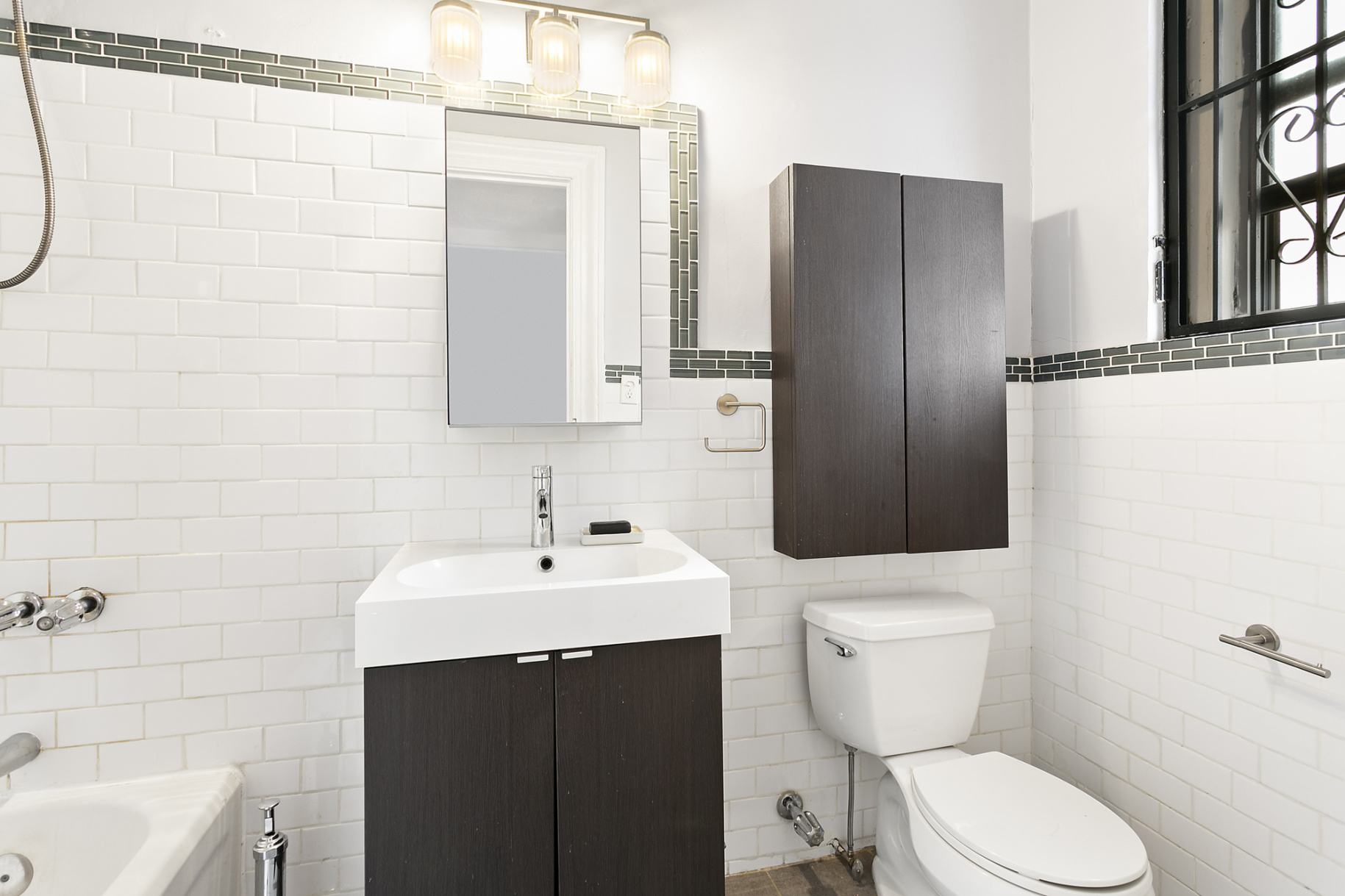 544 West 157th Street, Unit 85 Manhattan, NY 10032 - Photo 4 of 6 a bathroom with a sink toilet and shower
