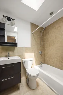 a bathroom with a sink a toilet and a bathtub
