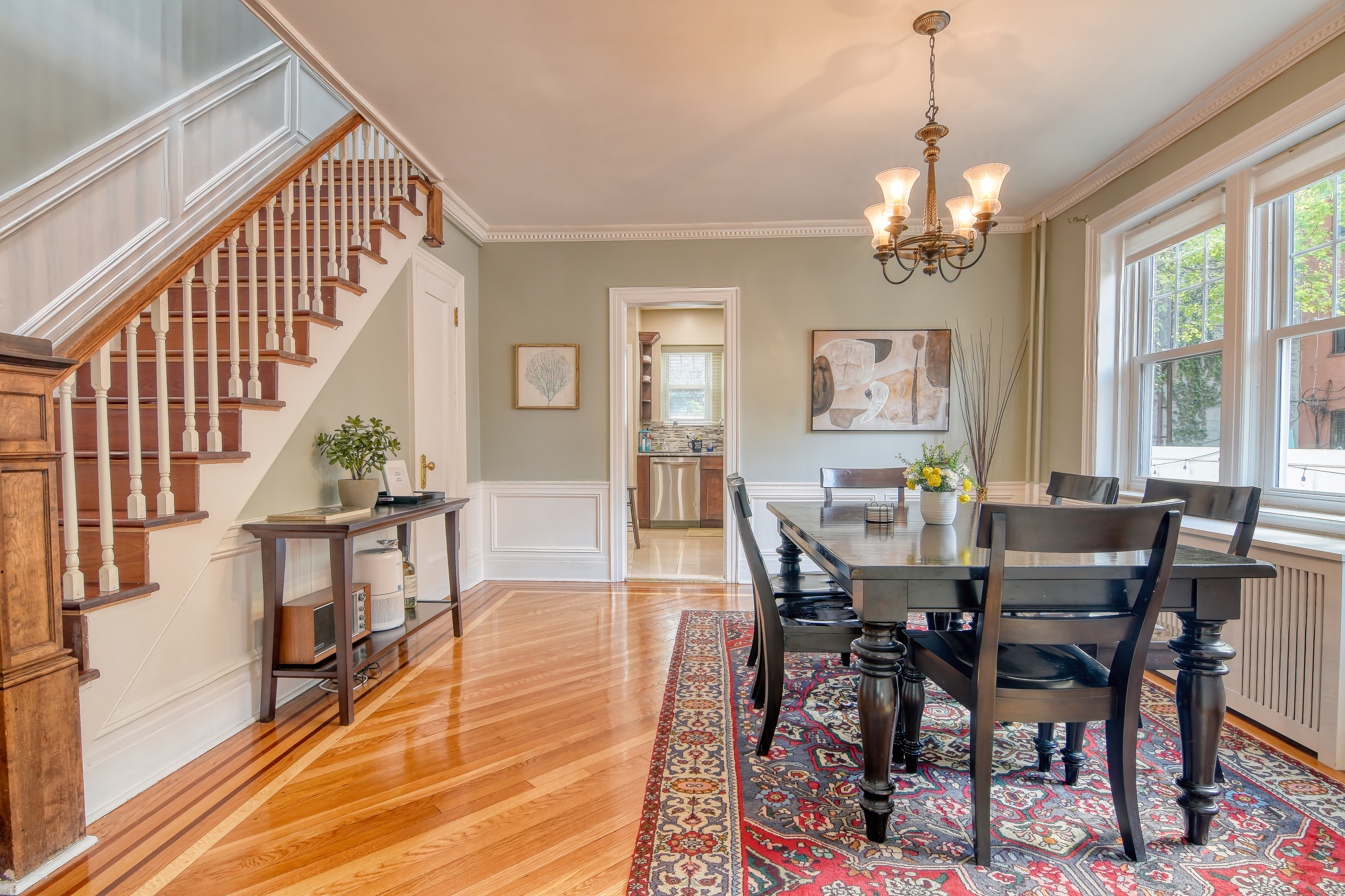232 Maple Street Brooklyn, NY 11225 - Photo 2 of 16 a view of a dining room and livingroom with furniture wooden floor a chandelier and a painting