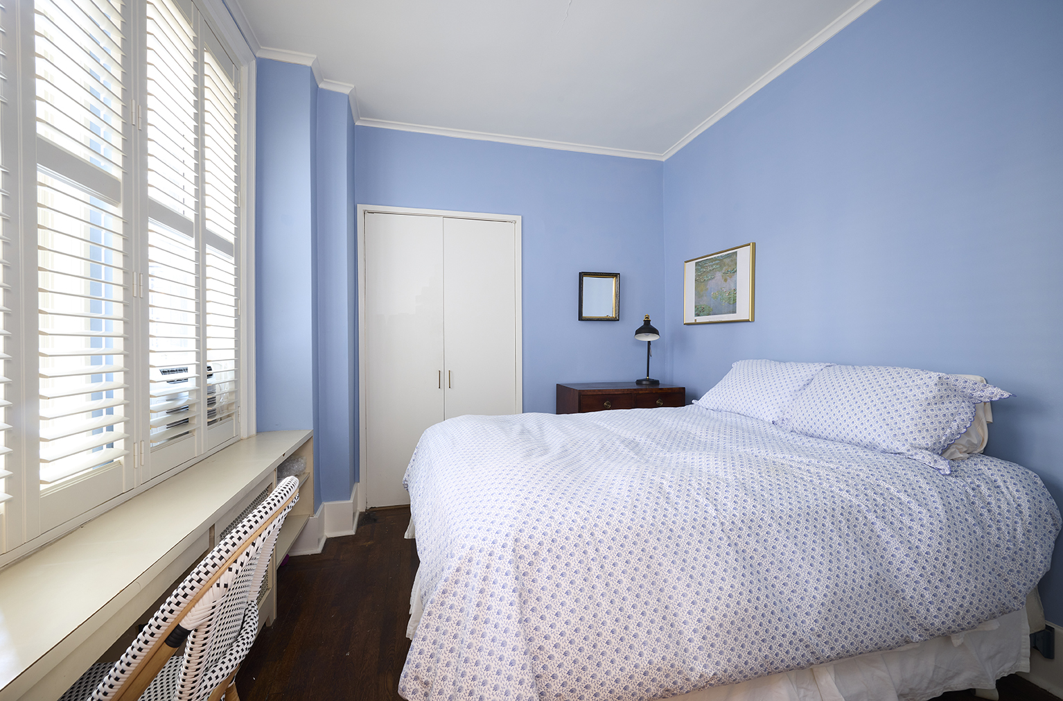 161 East 79th Street, Unit 7B Manhattan, NY 10075 - Photo 12 of 15 a bedroom with a bed and a large window with outer view