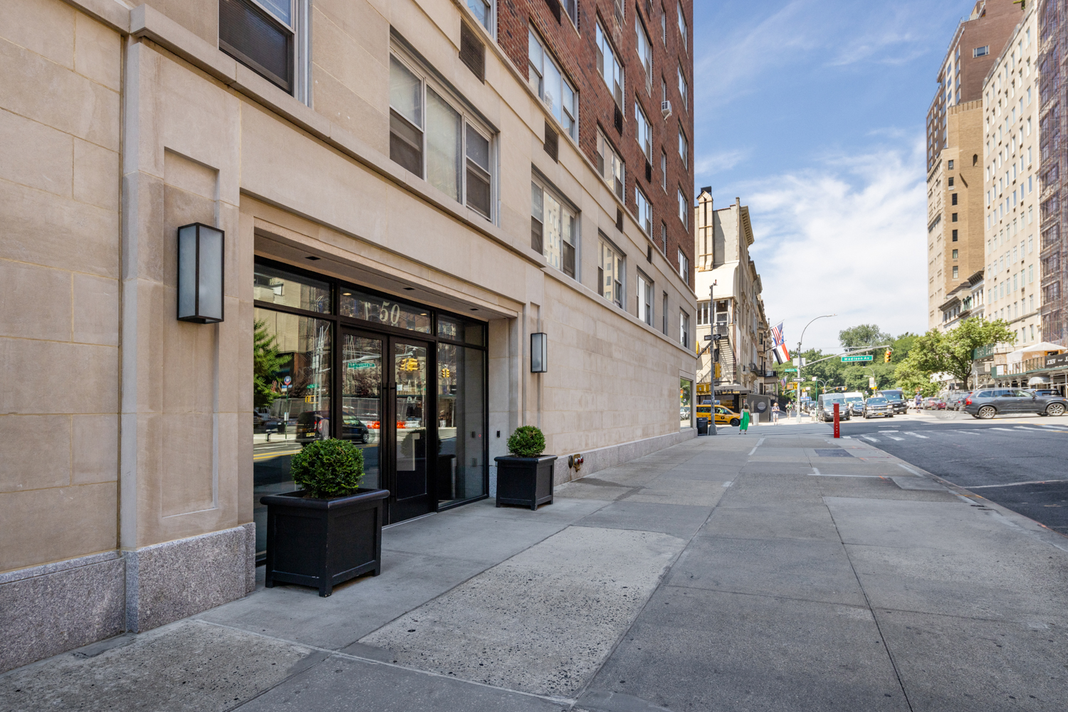 50 East 79th Street, Unit 7B Manhattan, NY 10075 - Photo 14 of 15 a view of a building along with potted plants
