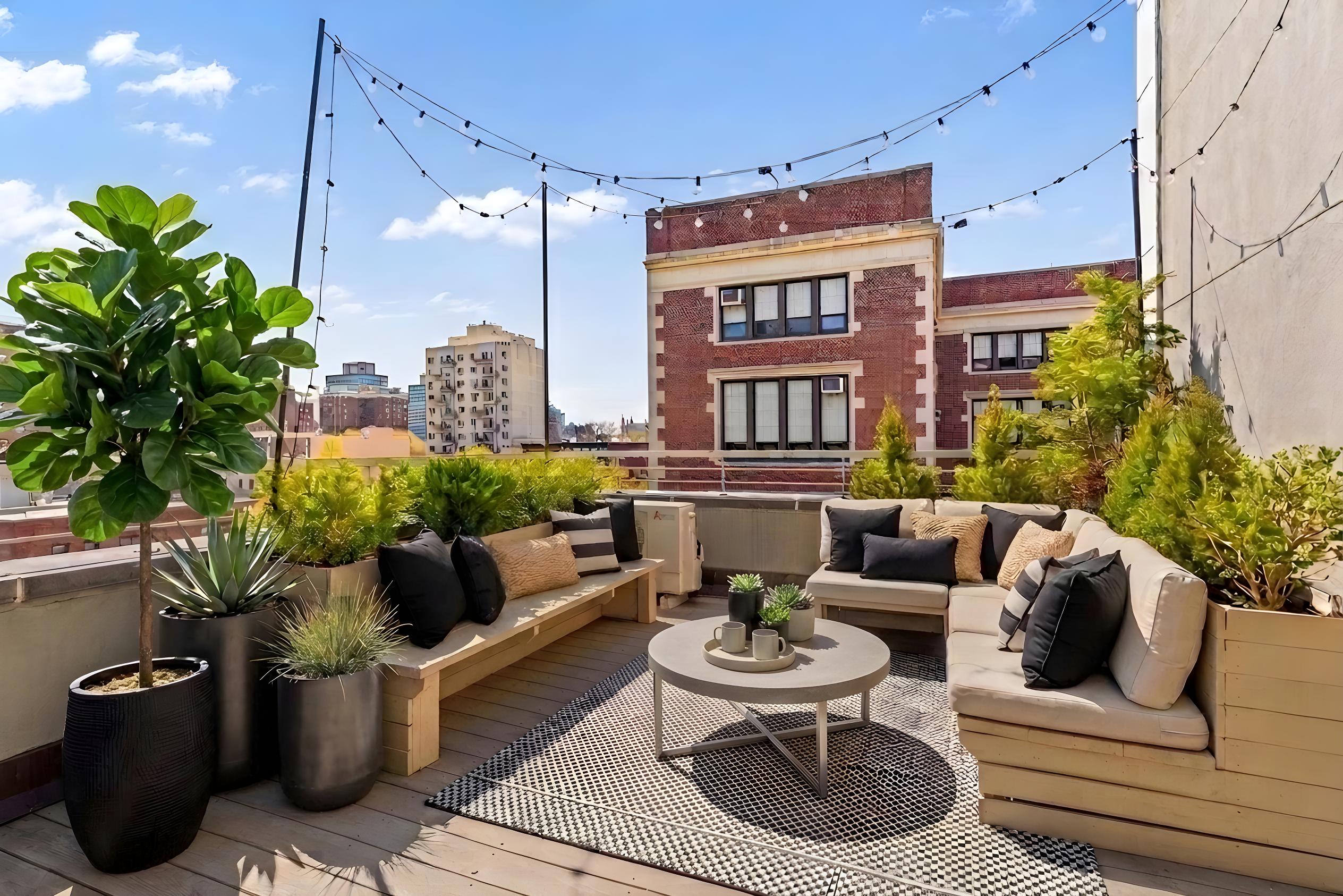 335 Warren Street, Unit 401 Brooklyn, NY 11201 - Photo 1 of 15 a outdoor living with furniture potted plant and a potted plant