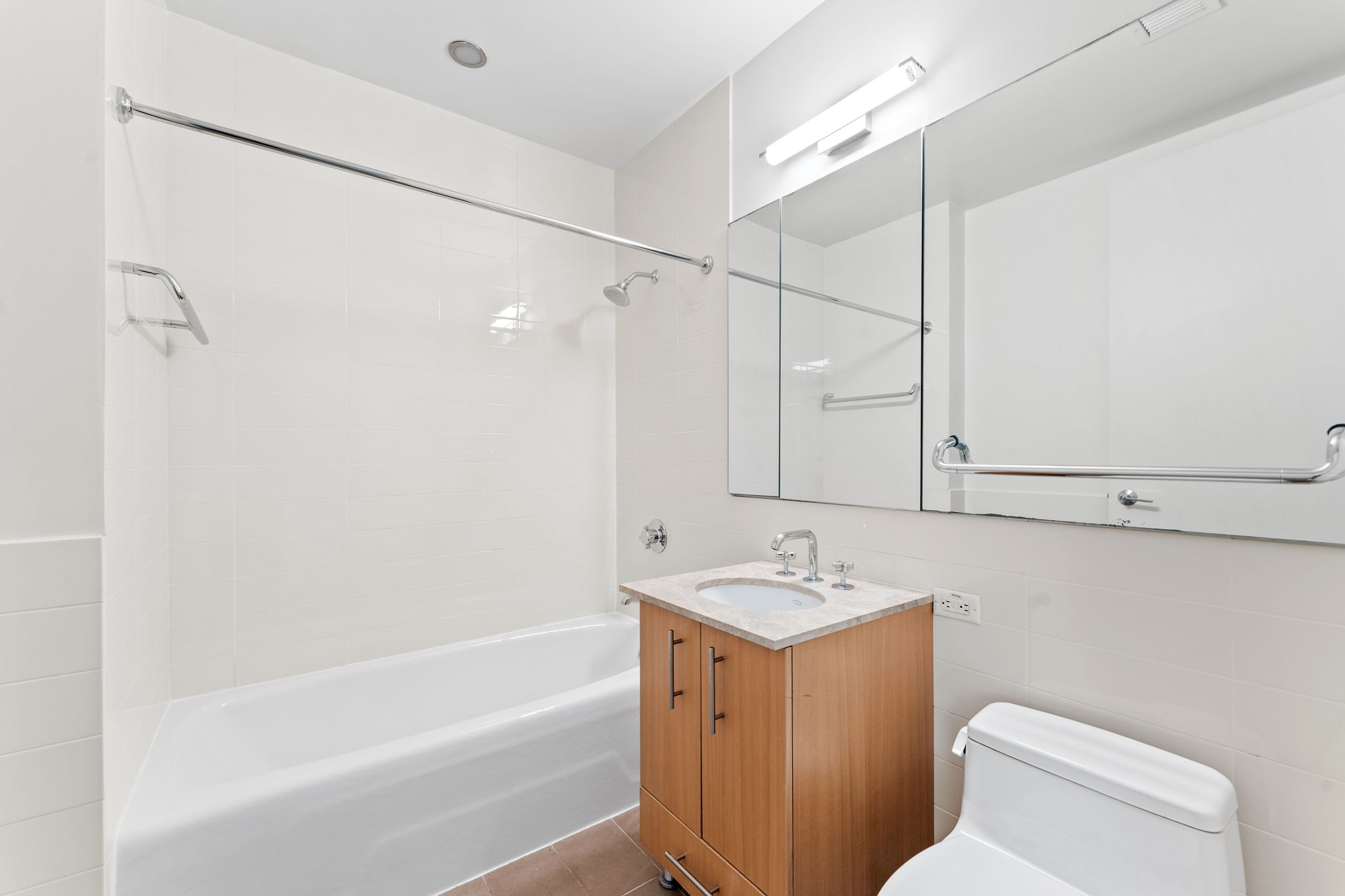 545 West 110th Street, Unit 5A Manhattan, NY 10025 - Photo 7 of 20 a bathroom with a granite countertop sink a toilet and shower