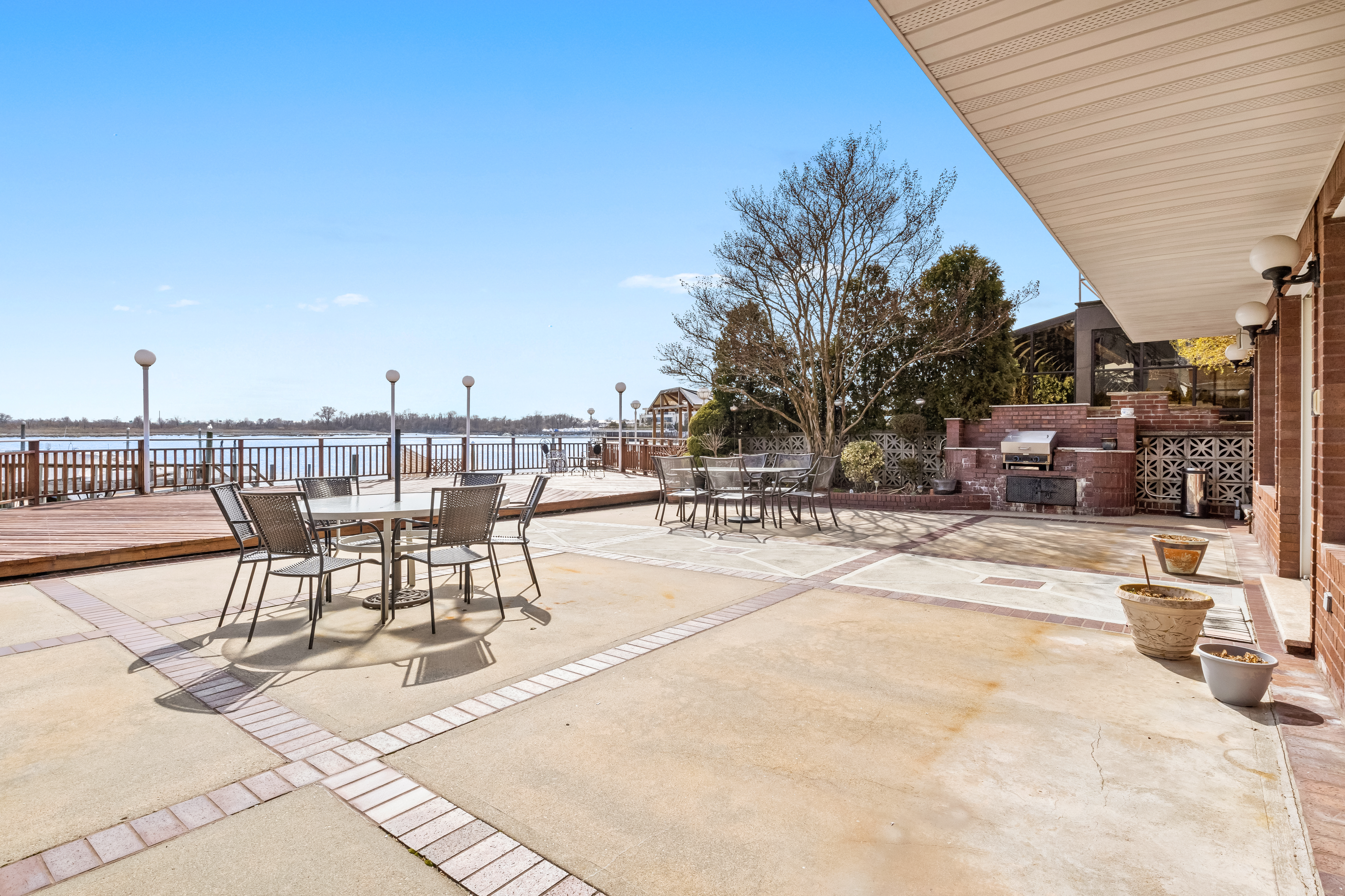 303 Whitman Drive Brooklyn, NY 11234 - Photo 9 of 37 a view of a swimming pool with outdoor seating