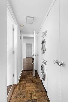 a view of a hallway with washer and dryer