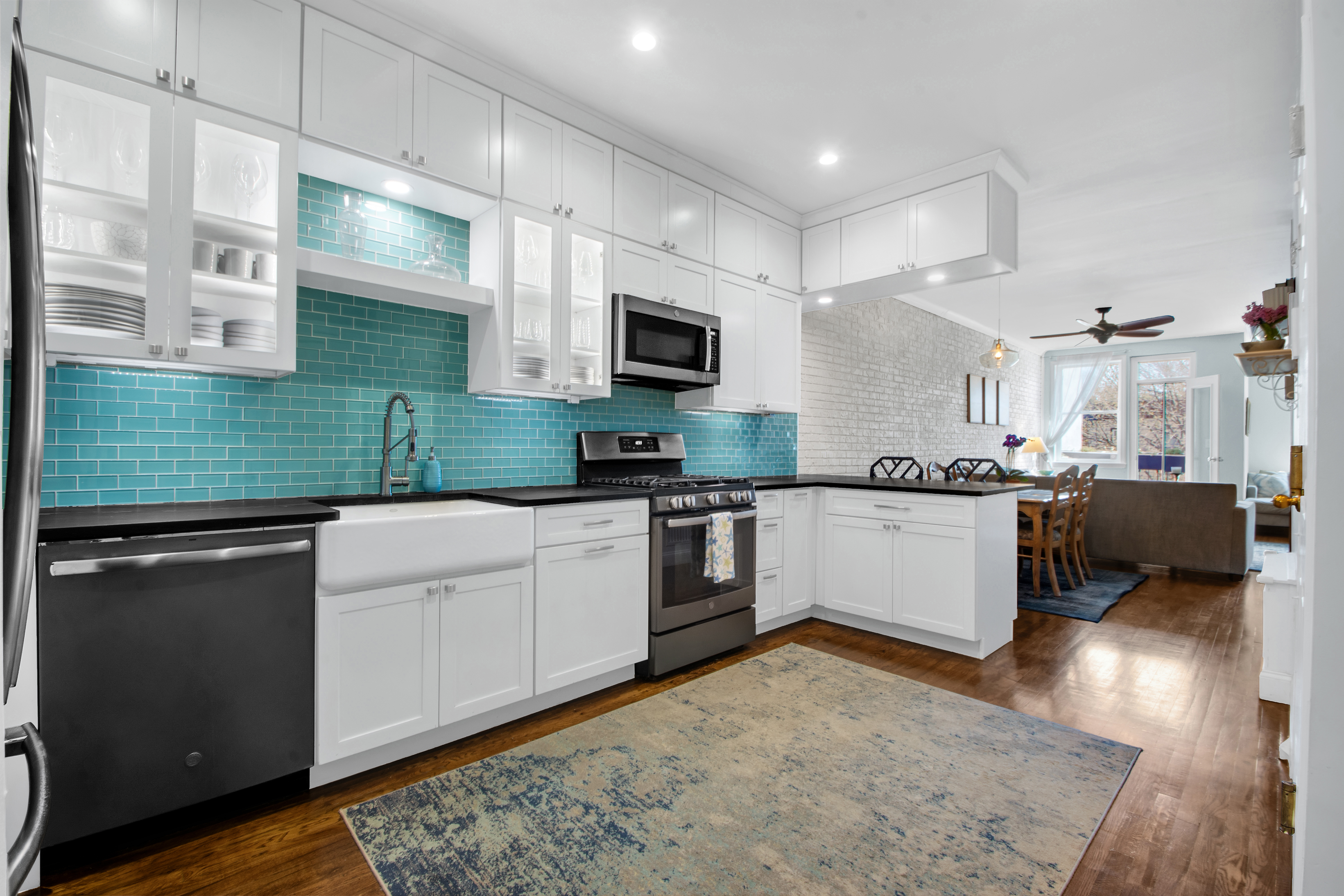 594 6th Avenue, Unit 3 Brooklyn, NY 11215 - Photo 4 of 11 a kitchen with a sink cabinets and stainless steel appliances