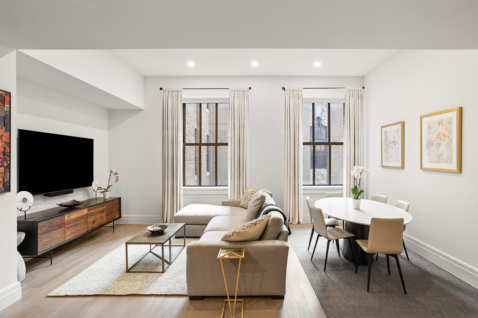 100 Barclay Street, Unit 17J Manhattan, NY 10007 - Photo 3 of 18 a living room with furniture and a flat screen tv