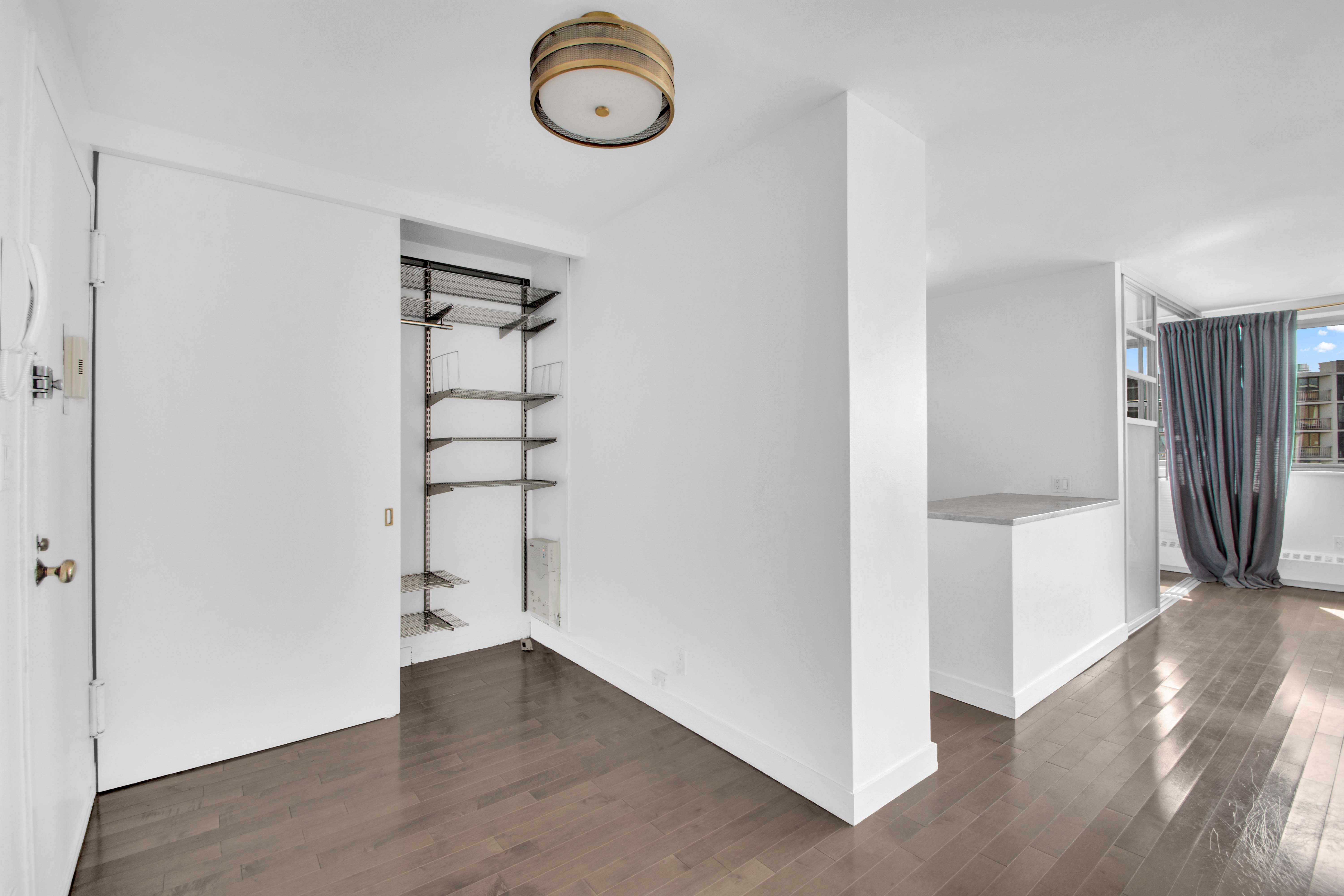 75 Henry Street, Unit 29J Brooklyn, NY 11201 - Photo 11 of 16 a view of a room with wooden floor