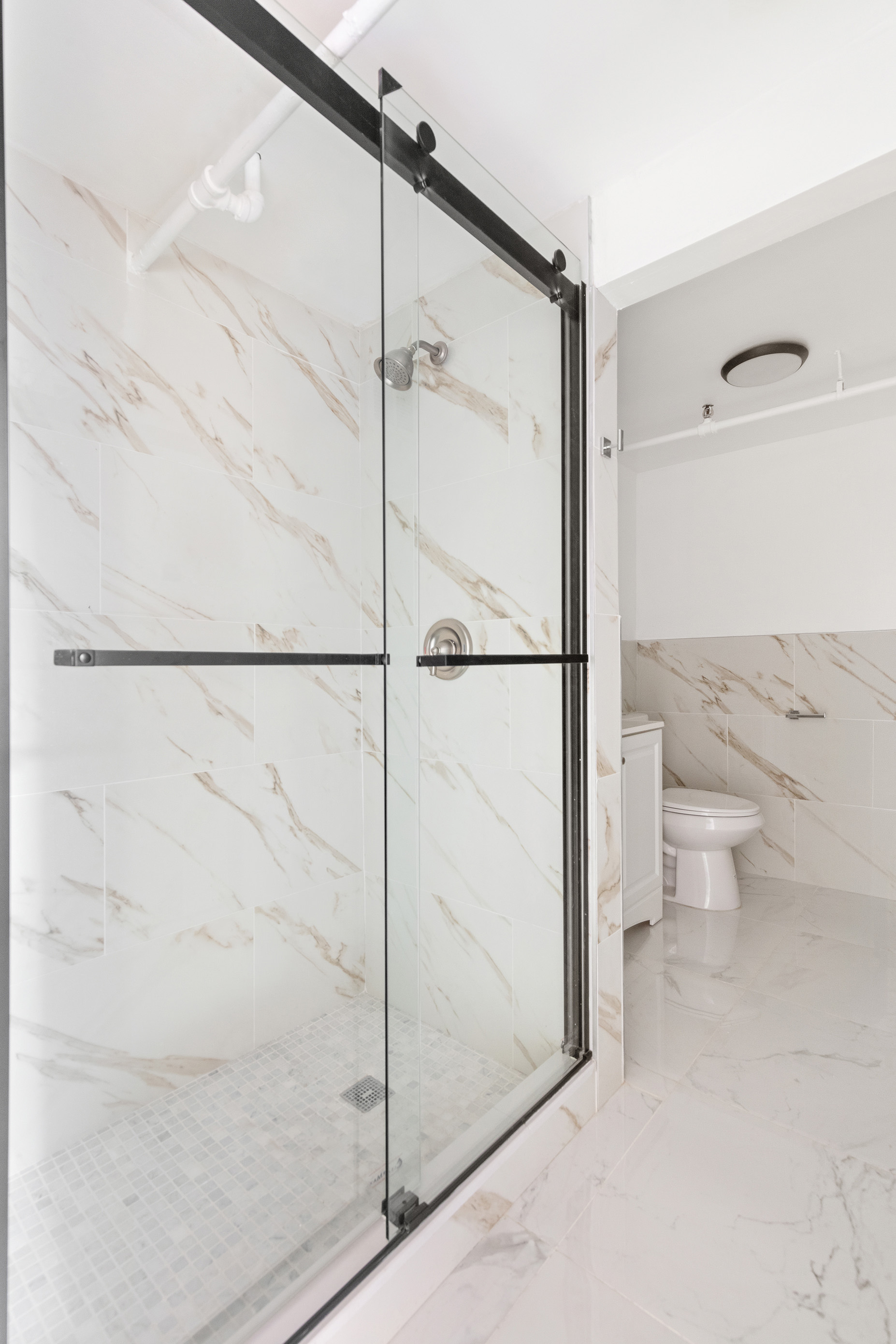 71 8th Avenue, Unit 4R Manhattan, NY 10014 - Photo 5 of 5 a bathroom with a toilet and a shower