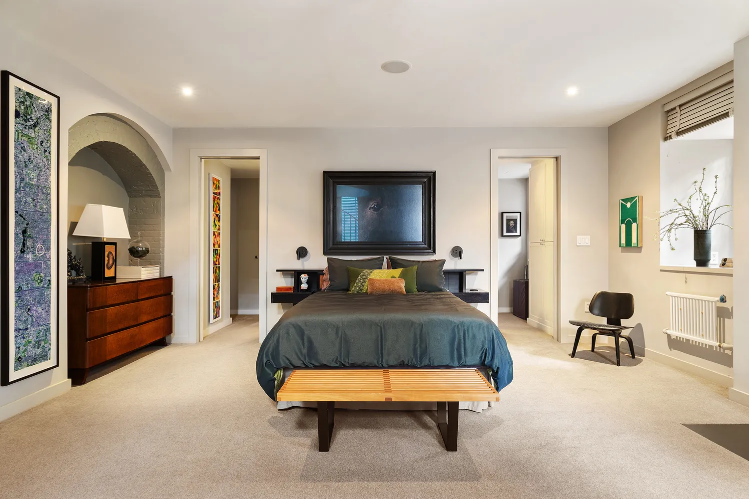 a living room with furniture and a lamp
