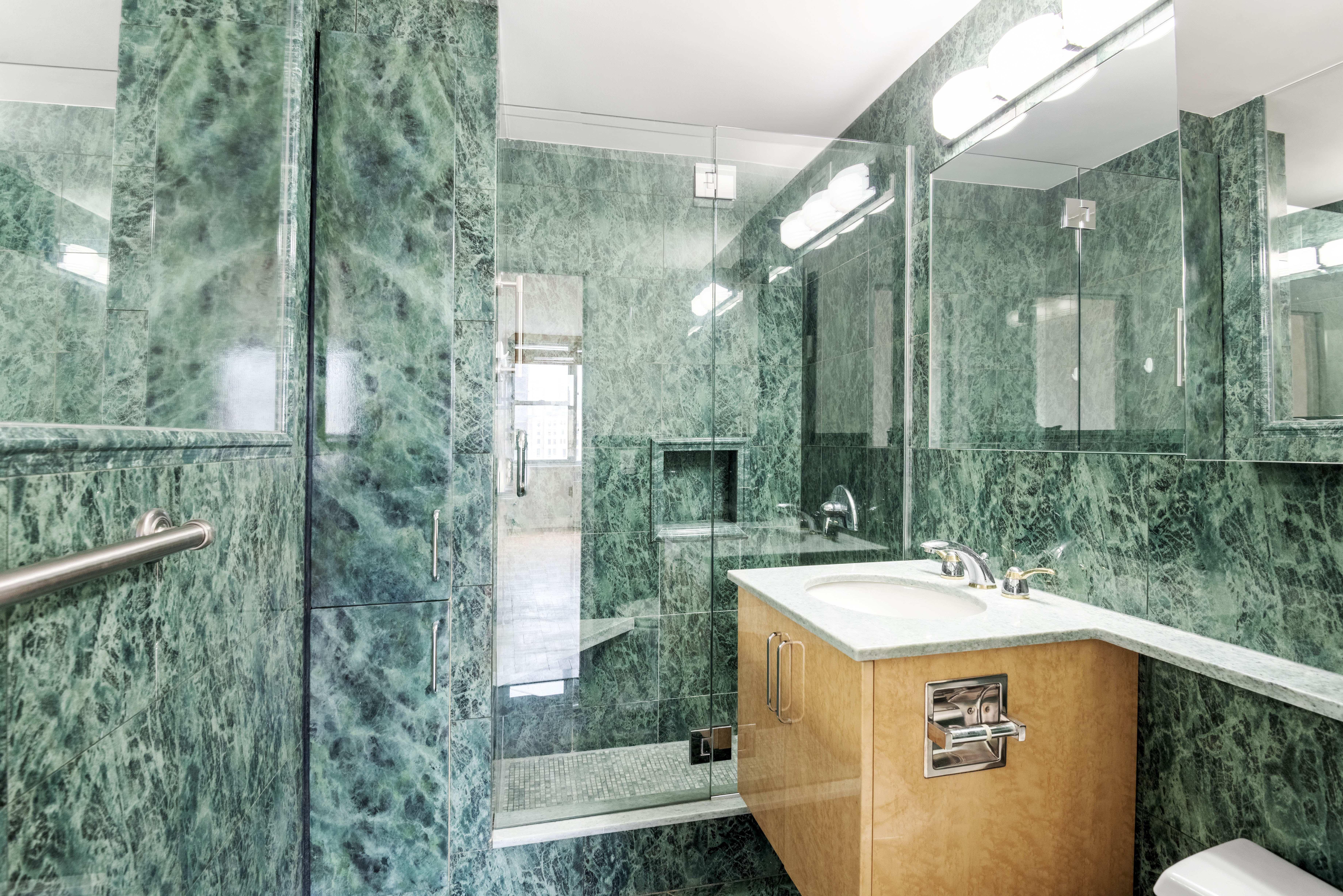 175 East 62nd Street, Unit 12A Manhattan, NY 10065 - Photo 12 of 24 a view of bathroom with sink and mirror