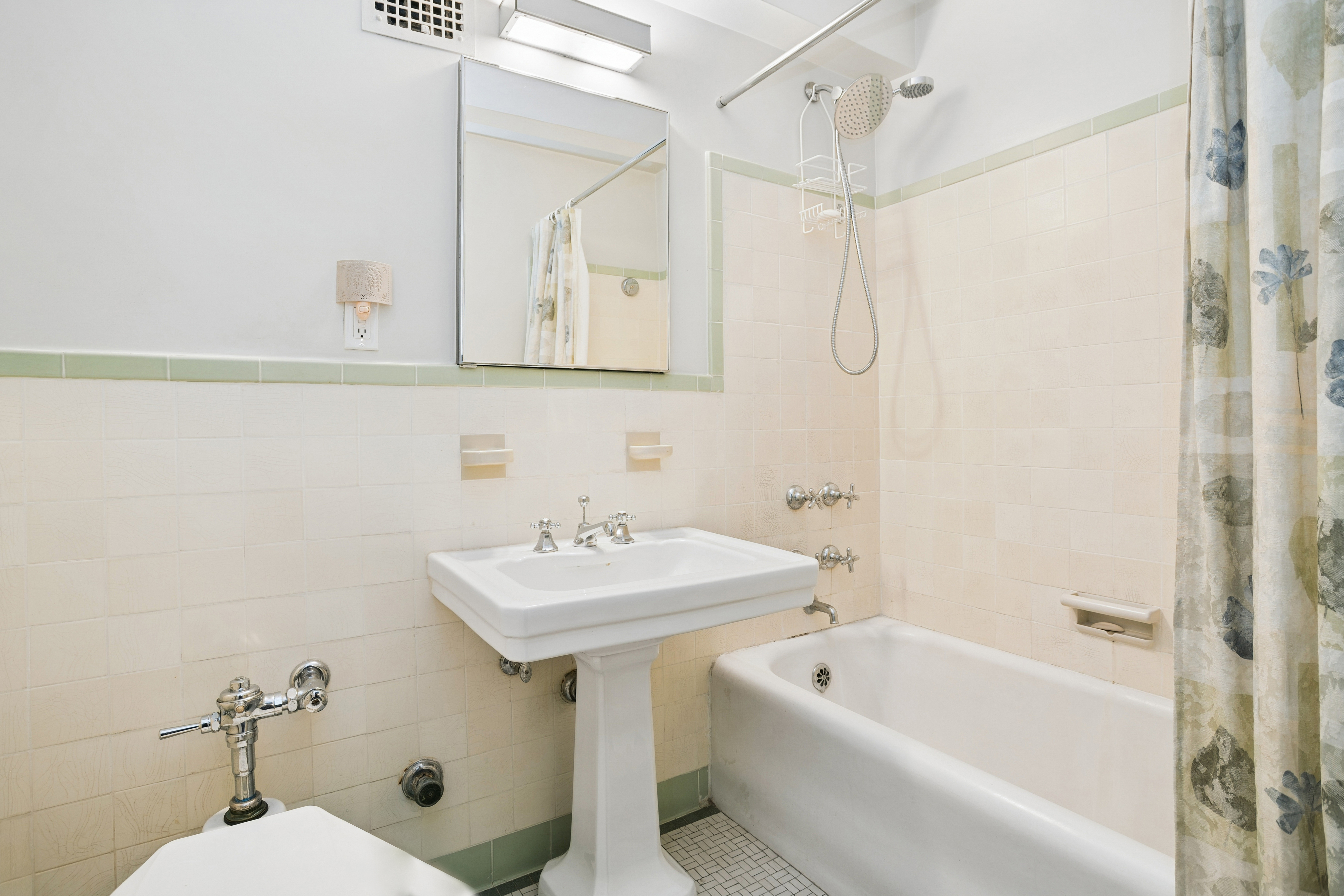 2 Beekman Place, Unit 12D Manhattan, NY 10022 - Photo 4 of 8 a bathroom with a sink a toilet and shower