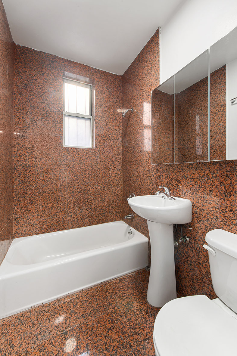 150 East 3rd Street, Unit 2D Manhattan, NY 10009 - Photo 4 of 4 a bathroom with a sink toilet and bathtub