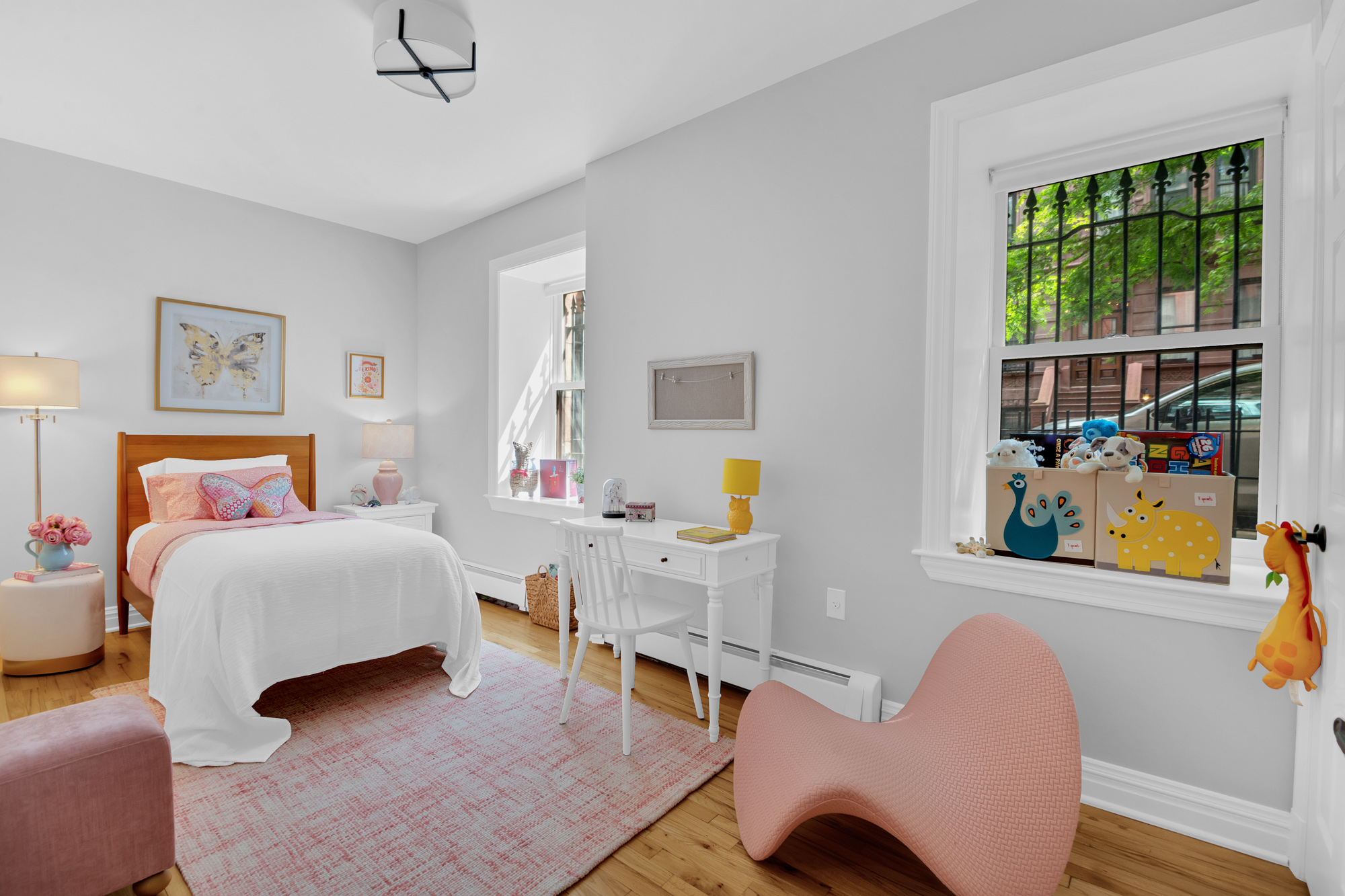 1 Mount Morris Park West, Unit 1A Manhattan, NY 10027 - Photo 9 of 12 a bedroom with a bed and a window