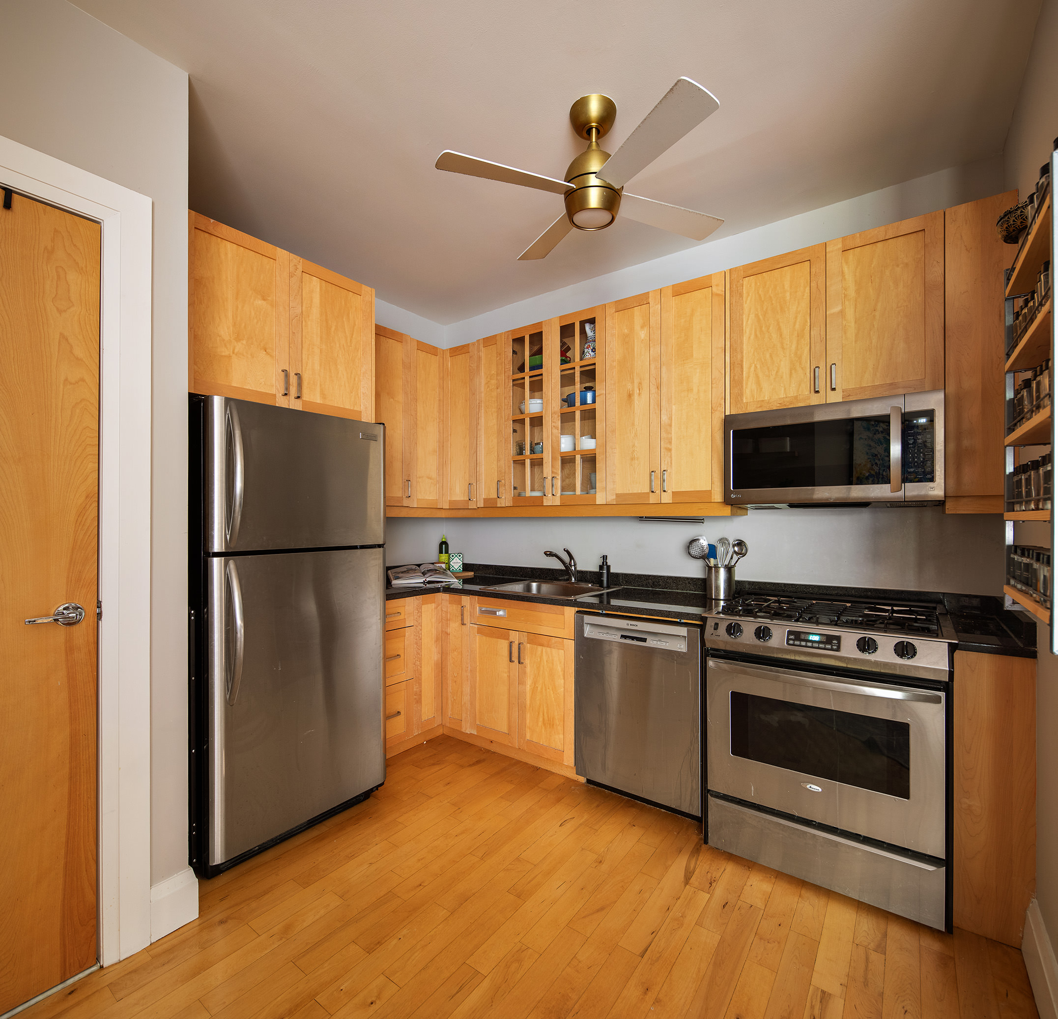 675 Sackett Street, Unit 210 Brooklyn, NY 11217 - Photo 2 of 8 a kitchen with granite countertop a refrigerator stove top oven and sink