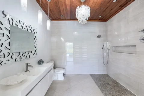 a view of a living room and kitchen with a large window