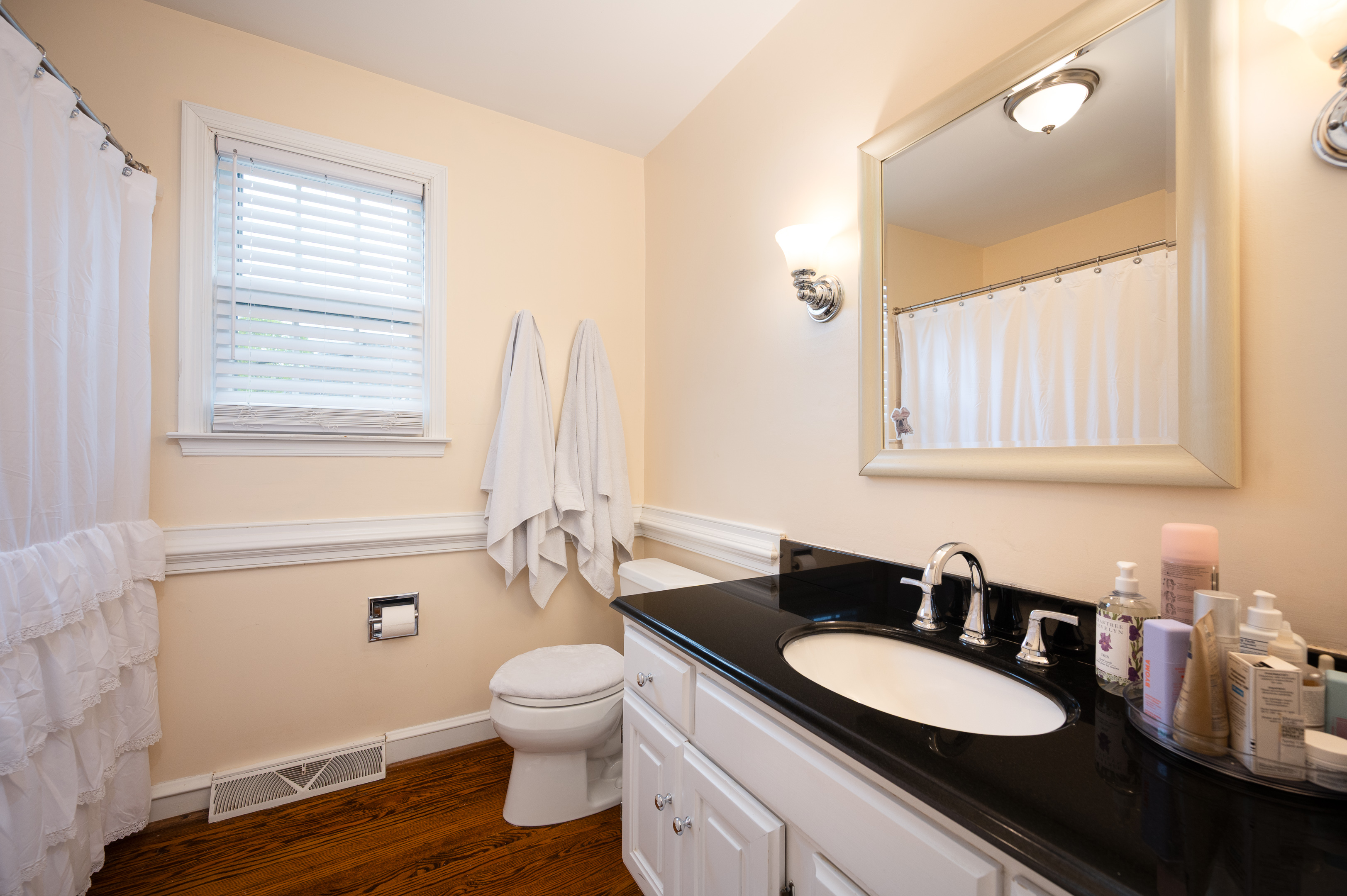 700 Blackshire Road Wilmington, DE 19805 - Photo 26 of 40 a bathroom with a granite countertop toilet sink and mirror