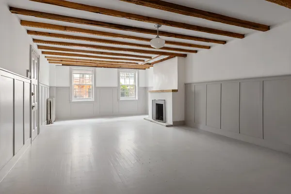 a kitchen with a refrigerator and cabinets